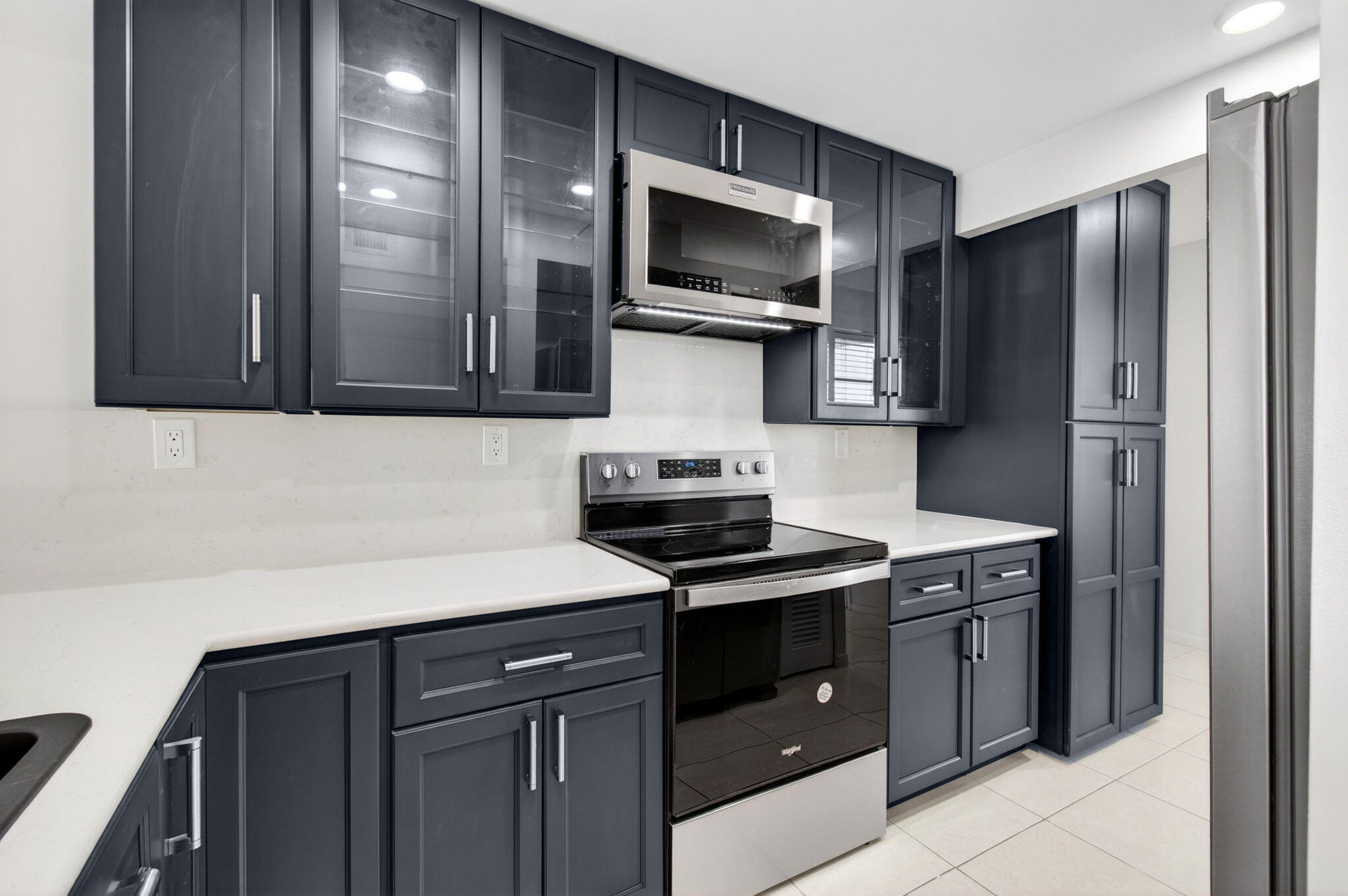 This beautifully renovated  2bed 2 bath corner residence is located just steps from the pool. Enjoy the serene canal settings from your screened in balcony. The newly renovated kitchen offers brand new stainless steel apliances and an oversized pantry for exceptional storage. Enjoy resort-style living with access to 5 heated pools, tennis courts, fitness centers, saunas, BBQ grills, car wash stations, and a nearly completed state-of-the-art clubhouse. Located within a 24-hour guard-gated community directly across from the prestigious Royal Palm Yacht Club and just minutes from Mizner Park, Downtown Boca Raton, parks, fine dining, shopping, entertainment, and pristine beaches. Water & cable with HBO included. Minimum 700 credit score required. Welcome to your East Boca waterfront retreat.  Dock slips available!