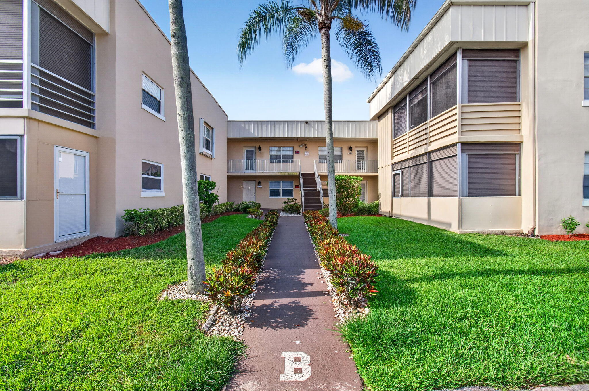 Move right into this bright and well-maintained 1 bedroom, 1.5 bath condo located in the highly desirable 55+ community of Kings Point.This clean and updated unit features newer flooring in the bedroom and screened balcony,tile flooring throughout the main living areas,no popcorn ceilings,no drop ceilings,and updated interior doors throughout. The covered balcony includes roll-down shutters, creating the perfect space to relax and enjoy the South Florida lifestyle.Kings Point offers resort-style amenities including multiple clubhouses, indoor and outdoor pools, golf courses, fitness centers, pickleball, tennis, cafés, live entertainment, courtesy shuttle service, social clubs, and so much more.Conveniently located close to shopping,dining,and major roadways.Move-in ready and easy to show.