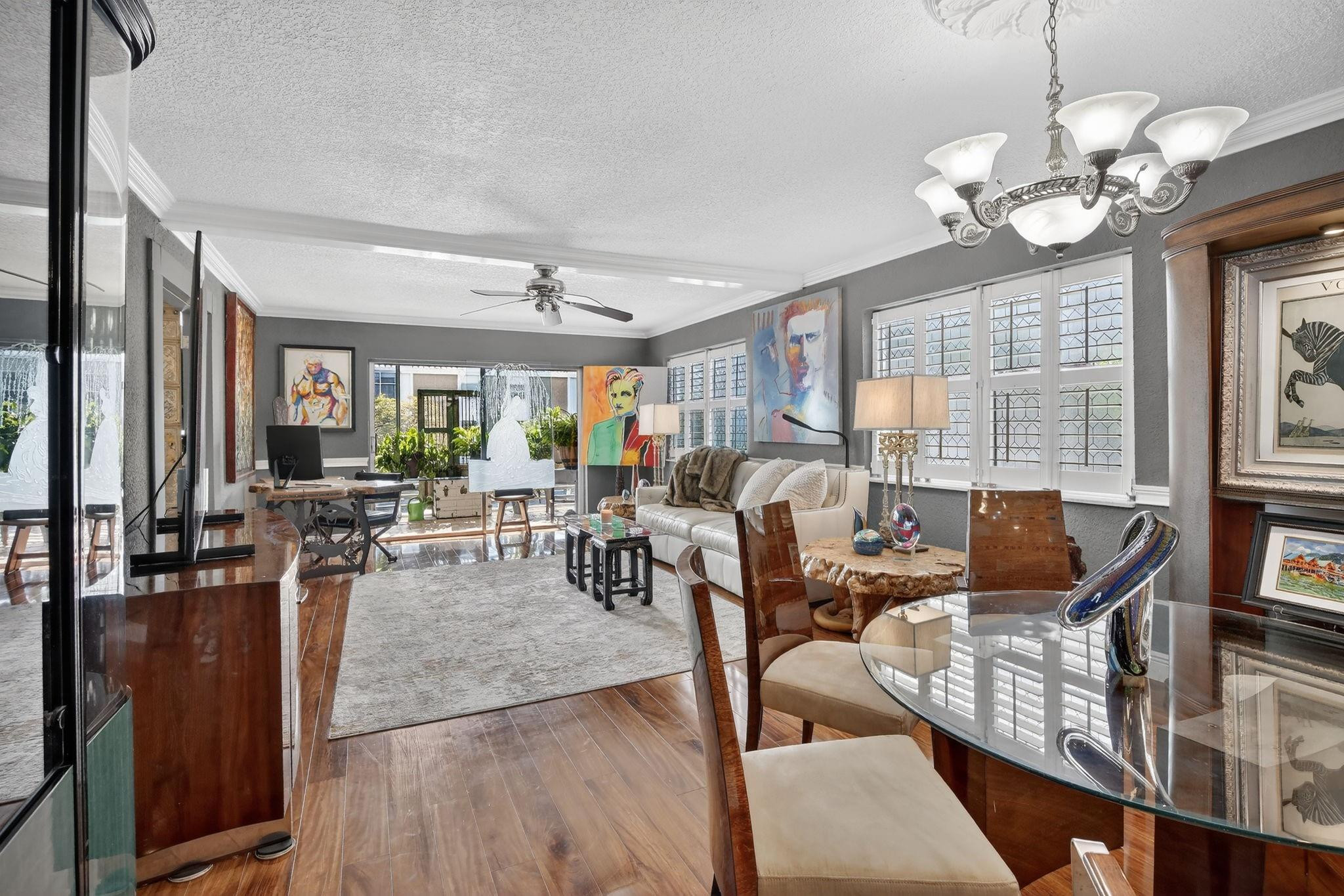 Stunningly renovated corner unit offering the best of Broward County connectivity. This spacious 2/2 unit features a modernized kitchen with high-end granite counters and custom tile, paired with updated bathrooms and durable Pergo wood-flooring throughout the living areas. Plantation shutters. Screened patio. Newer A/C, Water heater, and kitchen appliances.  Community Features: Gated Security, pool, gym, tennis courts, and BBQ area. Beautiful private walk along the Middle River.  Prime Location: Commuters and beach-lovers will appreciate being only 10 minutes from the ocean, downtown nightlife, and major shopping centers, with instant access to I-95. A perfect opportunity for buyers seeking a renovated, maintenance-free home in a central location.  Don't miss this one!