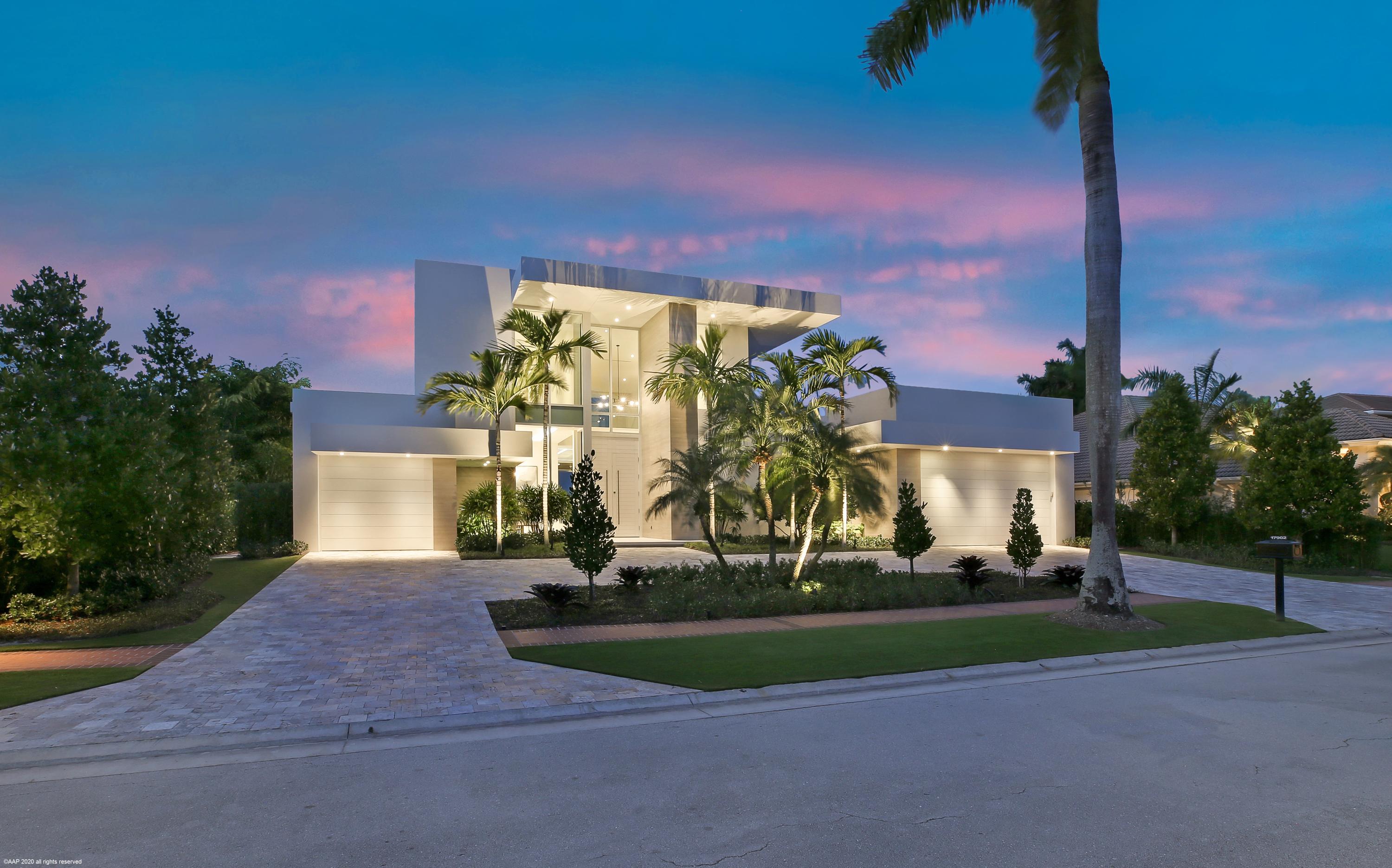 Come and discover this newly constructed modern furnished home within St. Andrews Country Club. Completed in 2019 by premier custom home builder Courchene Development. You will find elegant modern architecture throughout from your first step inside. The foyer features a stunning contemporary staircase with glass railing emphasized by a book matched marble slab wall. The great room features a lacquered built-in media center with marble ledge, clean modern ceiling with cove lighting, expansive 12' high sliding glass doors opening to the outdoor living with fireplace, BBQ grill, wet bar all overlooking the pool with wide golf course and water views. An open kitchen design makes for a seamless transition from the great room as well as an incredible layout for entertaining both small and large groups. The kitchen features Sub Zero and Wolf appliances with a custom-built quartzite hood that is the center piece of the kitchen. Just off the great room there is an oversized club room that doubles as additional media space and office or can be transformed into a playroom or flex space. The master suite features separate "his and her" bathrooms with separate oversized closets ready for clothes to be unpacked. This "smart" home also features an automated lighting system, built in ceiling speakers, impact glass throughout and so much more. Second floor furnishings are available in addition to this offering. Come and see this astonishing home today. All measurements are approximate, subject to error, omission and changes without notice.  In the event of a buyer default, and there are retained deposits as liquidated damages, cooperating broker shall not participate in any retained deposits paid to listing broker. Broker Commission subject to successful closing and title transfer.