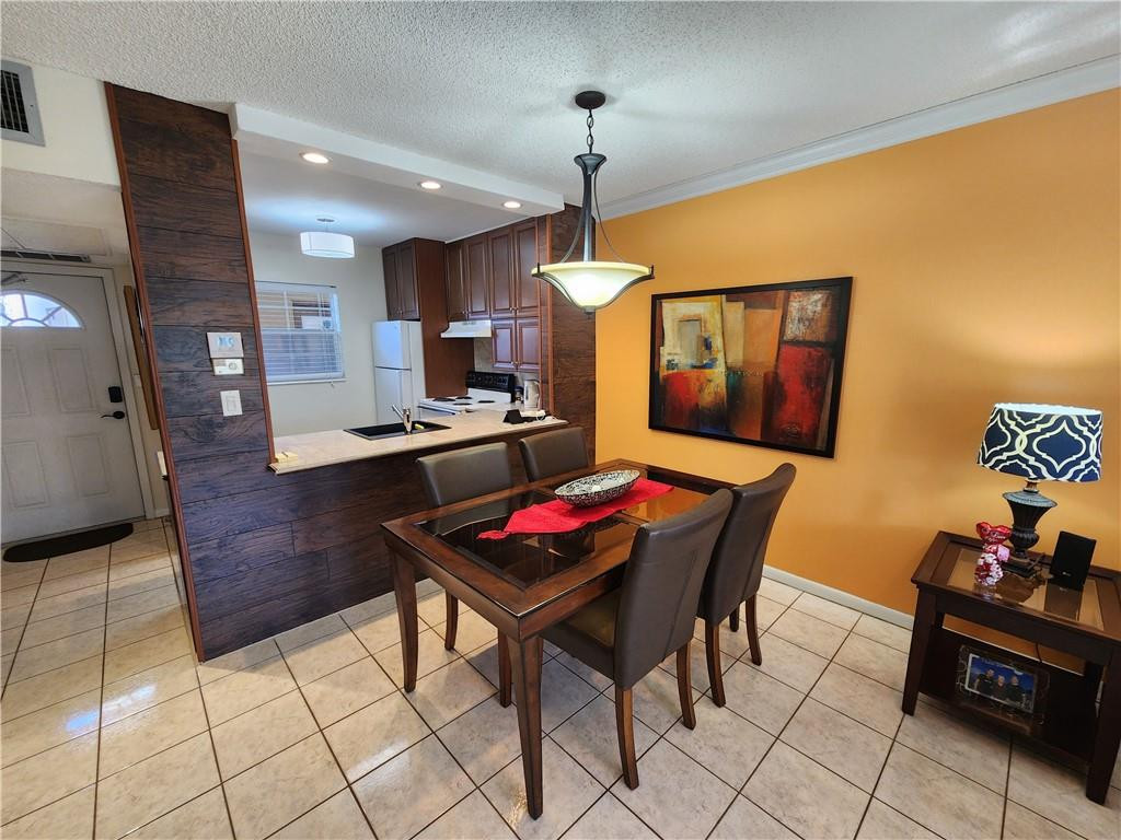 Beautifully Completely Renovated 1 bedroom unit on Ground floor, Fully furnished "Turnkey move in ready". Kitchen and bathroom are completely & tastefully redone, New cabinets & countertops. Beautiful ceramic floors. Recent AC (2020) & Hot water tank (2019), "New building Roof (2022)!" ***All assessments have been paid in full.*** Beautiful view of Lagoon. This 55+ community also include High Speed Internet connection, Newly redone community heated pool, shuffleboard, gym, Sauna, library, Renovated Community kitchen and Hall, club house. Close to turnpike, groceries store restaurants. Low condo fees! These condos have great VALUE for south Florida!