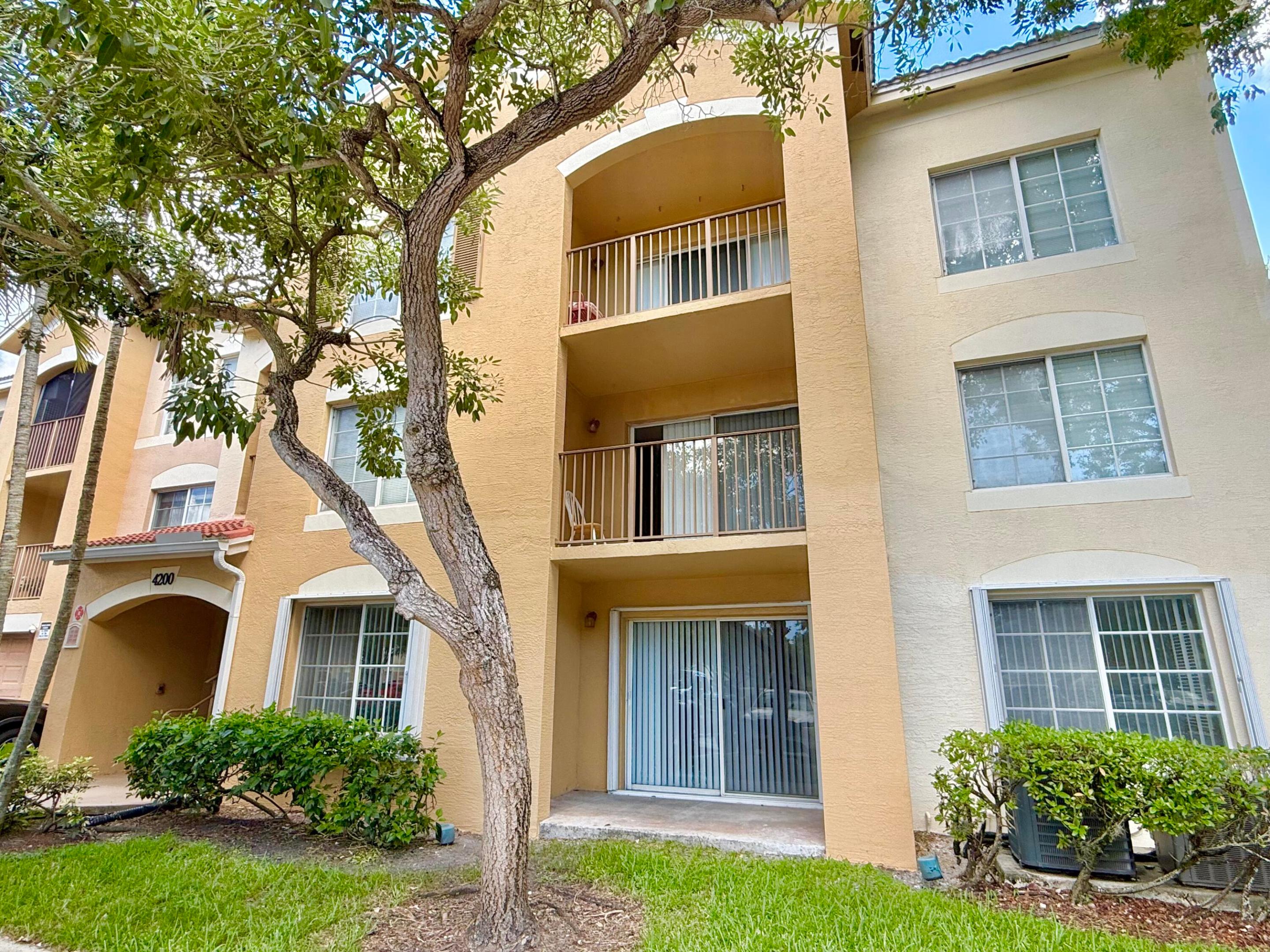Investors welcome. Discover exceptional value in this 1st-floor 2-bedroom, 2-bath condo in the gated community of Emerald Isle at Laguna Lakes.  The residence features complete hurricane protection with accordion shutters. Recent updates include a new roof (2023), HVAC condenser (2024), and water heater (2018). A full-size washer and dryer are included. Residents enjoy resort-style amenities, including a pool and spa, fitness center, game room, children's playground, pickleball courts, and an indoor basketball court. The HOA provides outstanding value by covering cable, high-speed internet, water, sewer, trash, building insurance, and roof maintenance. Pet-friendly community, allowing 1 pet with no weight restrictions (aggressive breeds prohibited). 2 leases/ year allowed, 180 day min each Ideally located in the heart of West Palm, this home offers effortless access to Downtown, I-95, Palm Beach Outlets, beautiful beaches, dining, shopping, and all the area's premier attractions.
