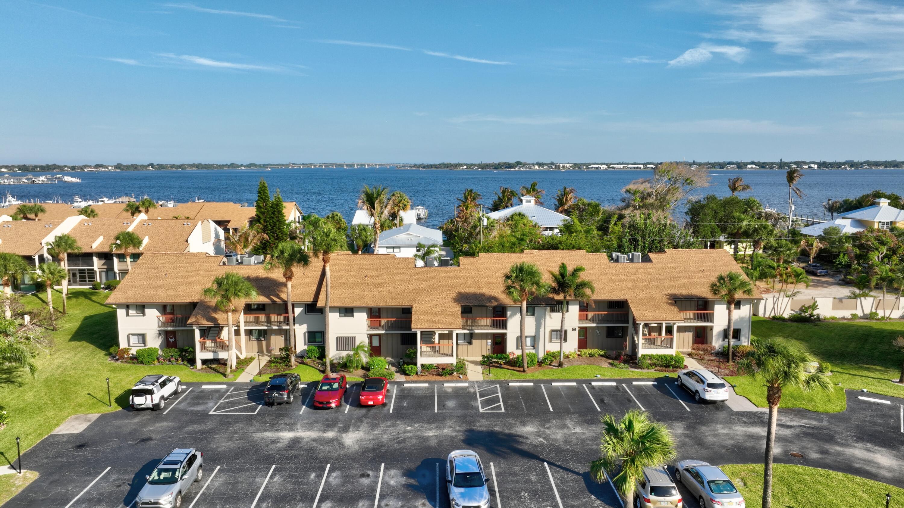 Embrace the coastal lifestyle in this charming first floor 2/bedroom 2/bath residence in River Club with Beautiful grounds and stellar views of the river, featuring newer Kitchen, Murphy bed in 2nd bedroom, updated bathrooms,Hurricane front door, 11/2021, Air Conditioner 3/19, Roof 1/2025, a glass enclosed Sun room plus extended outdoor paved patio area. Community amenities include heated pool, clubhouse, exercise room ,Game room, social activities, barbecue grills and a boat shed complete with an ice machine. Everything you need for the ultimate waterfront lifestyle you will love the opportunity to purchase a 30 foot boat slip for an additional 60,000 making it the perfect retreat for enjoying life on the river 10 minutes to the ocean no fixed bridges. "Paradise found" Run don't walk. Patio Sliders Are Impact Glass Ceiling to Floor. All furnishings are fairly new and may be purchased as a package