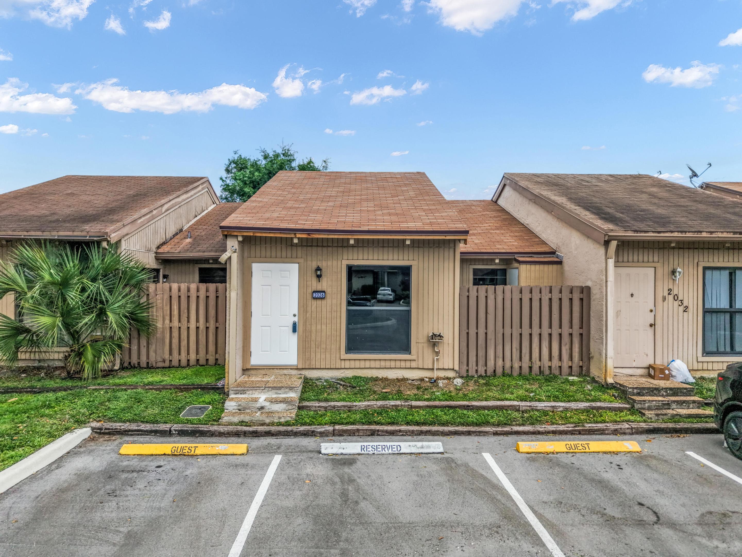 BRAND NEW ROOF! Come see this charming Davie townhome with a private fully fenced backyard and front gated porch. Features vaulted ceilings, split bedrooms, 2 full baths, and an eat-in kitchen with stainless steel appliances. Located in an all-ages community with clubhouse, pool, playground, and tennis courts. Close to highways, Nova schools, shopping, and dining. Perfect for first-time buyers or investors!
