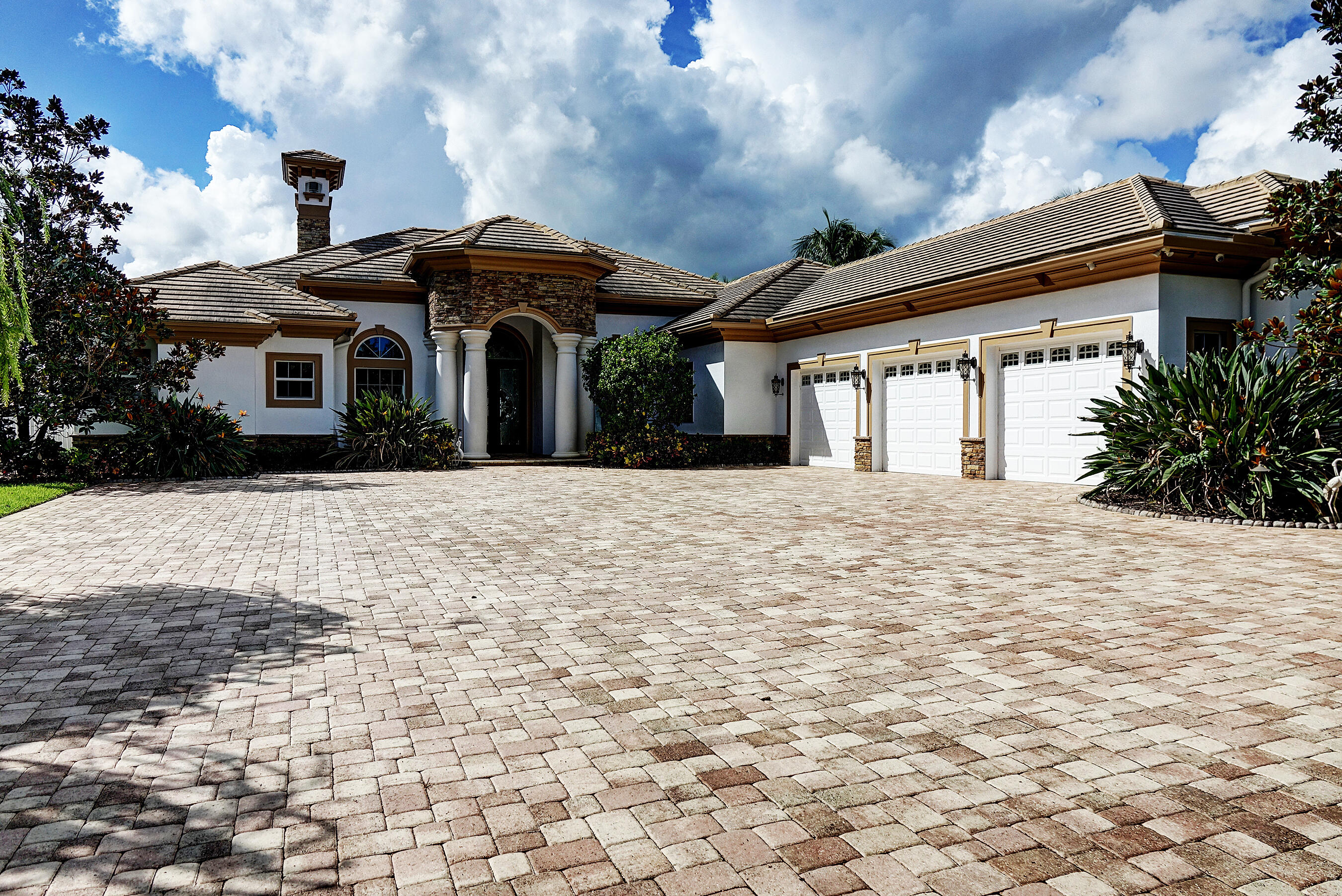 Luxury living on the St Lucie River in this one-story custom 2016 gated estate on 1 acre at end of private cul-de-sac. With 4 bedrooms,4 baths,& nearly 5,000 a/c sq ft,this home blends elegance, privacy,& functionality. CBS construction, all impact glass,3 zoned A/C's,3 Tankless Water Heaters,3-car A/C garage,& whole-house generator ensure peace of mind. Coffered ceilings, crown moldings, wet bar, open layout,& designer finishes showcase craftsmanship. The luxurious Primary bathroom feels like a spa w/deep soaking tub, dual vanities, walk-in glass shower,& designer finishes,& the 2 walk-in closets have custom built-ins.The gourmet kitchen features Subzero, Wolf,& Bosch appliances, granite countertops & island opening up to expansive living areas and riverfront views. Elevated outside living includes an infinity pool & spa,pergola w/summer kitchen,travertine decking,lush landscaping,& a dock w/16,000 lb lift.Modern design,wide-water frontage,& resort-style amenities.Brand new seawall.Water and sewer coming soon.