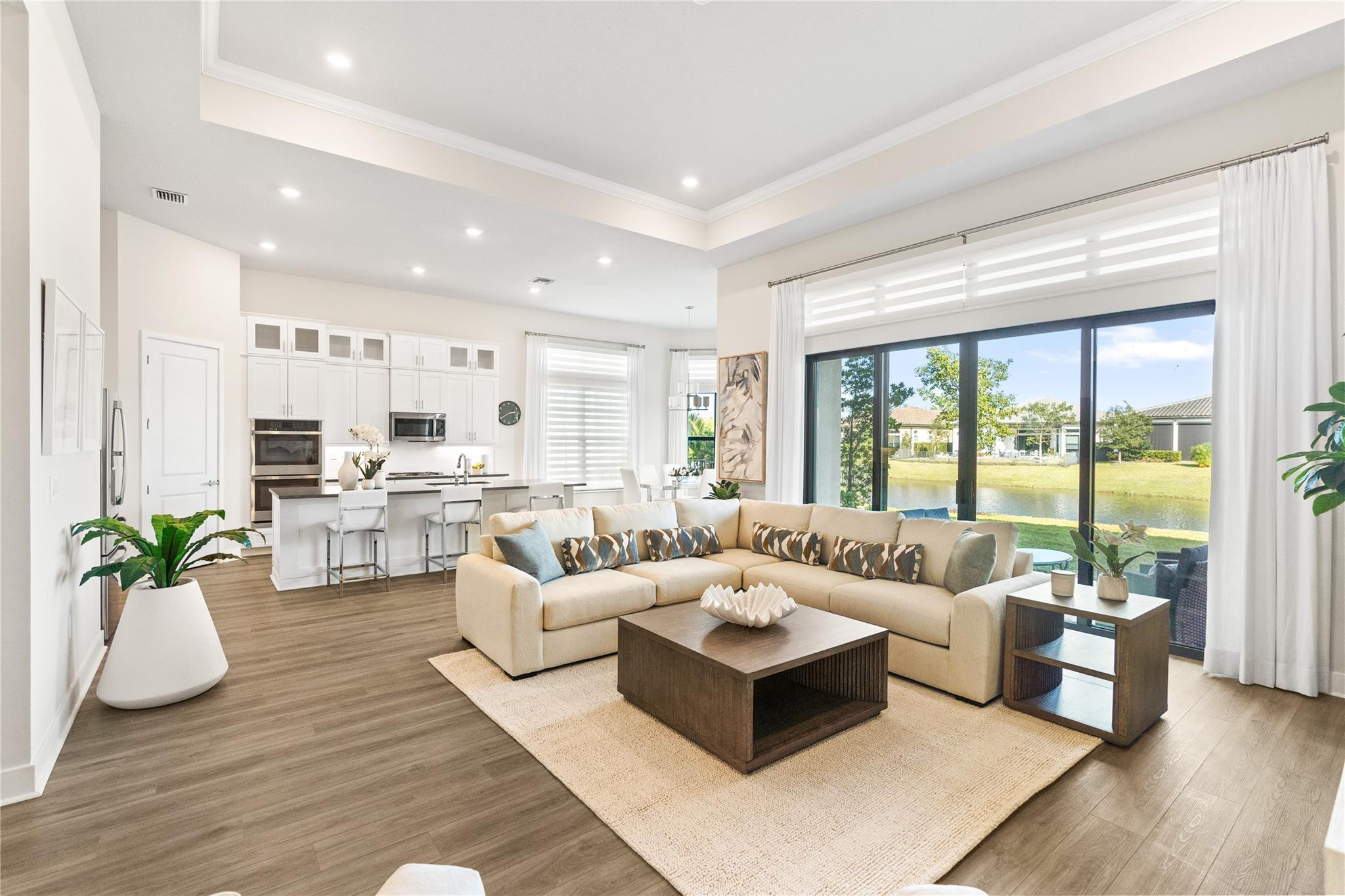 Welcome to this stunning waterfront single-story residence in The Falls of Parkland, where 2,495 square feet of thoughtfully designed living space awaits. This 3-bedroom, 2 1/2 bath home offers an excellent layout across one floor. Perfect for seamless everyday living and entertaining. The 2-car garage provides convenient parking and storage, while the waterfront location adds a special dimension to your daily experience. The back yard is large with amply space to build your own customized pool. Situated in the desirable Falls of Parkland community in Parkland, Florida, this property combines comfort with the unique appeal of waterfront living and the Clubhouse is resort style with restaurant serving breakfast lunch and dinner. Schedule Today.