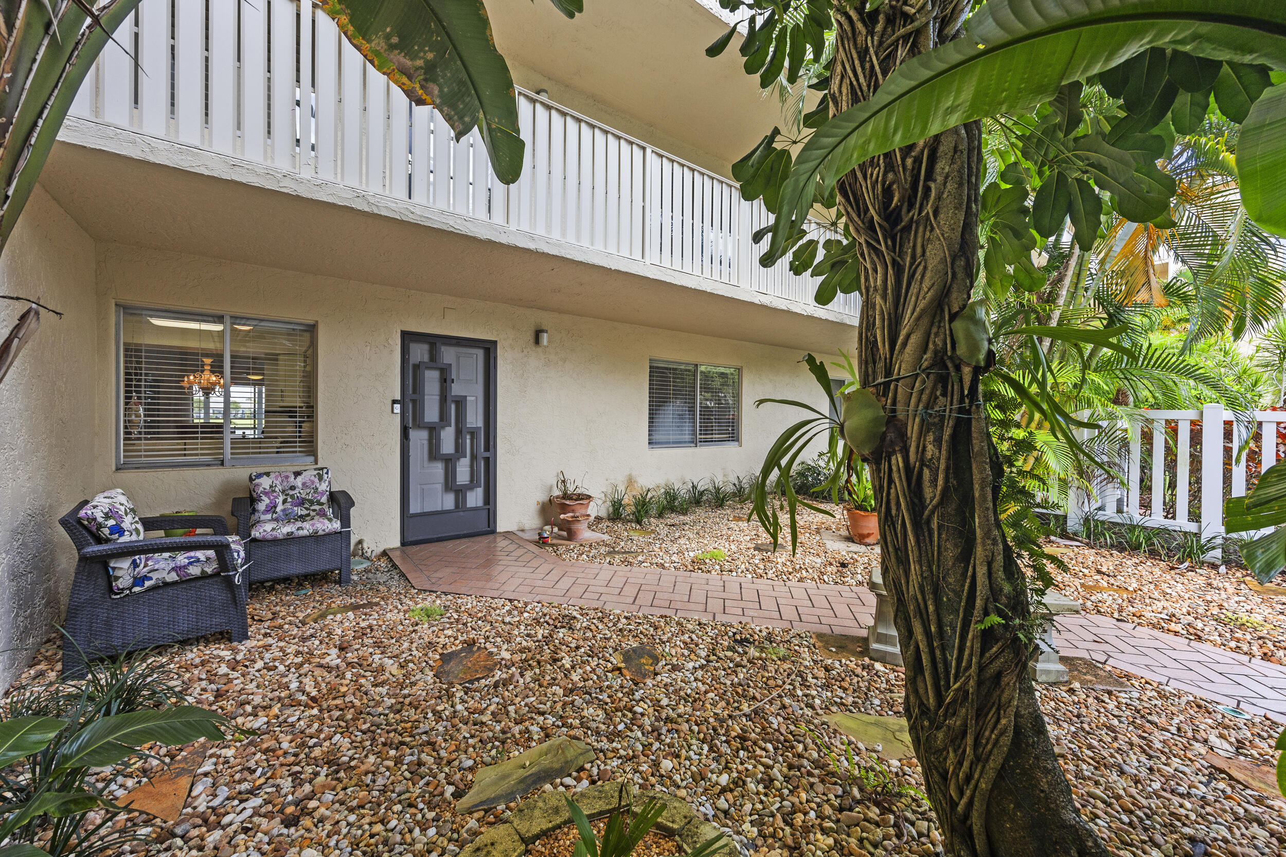 WELCOME TO THE HIDDEN GEM OF HUNTINGTON LAKES! Rarely available and beautifully updated 2 bedroom, 2 bathroom first floor residence offering the perfect blend of comfort, style, and serene South Florida living. From the moment you arrive, you'll fall in love with the private garden porch oasis, an incredibly unique feature that makes this home stand out from the rest. Inside, enjoy a light, bright, freshly painted interior featuring updated finishes, beautiful flooring, renovated kitchen and baths, 2 large walk-in closets in the master bedroom, new washer and dryer, and new hot water heater. The spacious layout flows effortlessly into the oversized screened lanai overlooking tranquil water views, creating the perfect space to relax and unwind morning or night.  Turnkey, affordable, and move in ready, this is the ideal opportunity to enjoy the sought after 55+ Delray Beach lifestyle. Huntington Lakes offers incredible amenities, an active community atmosphere, and an unbeatable location just minutes from Delray Marketplace, Downtown Delray Beach, shopping, dining, entertainment, and major highways. If you've been searching for an updated home with outdoor charm, peaceful views, and true value in Delray Beach, this is the one you do not want to miss!