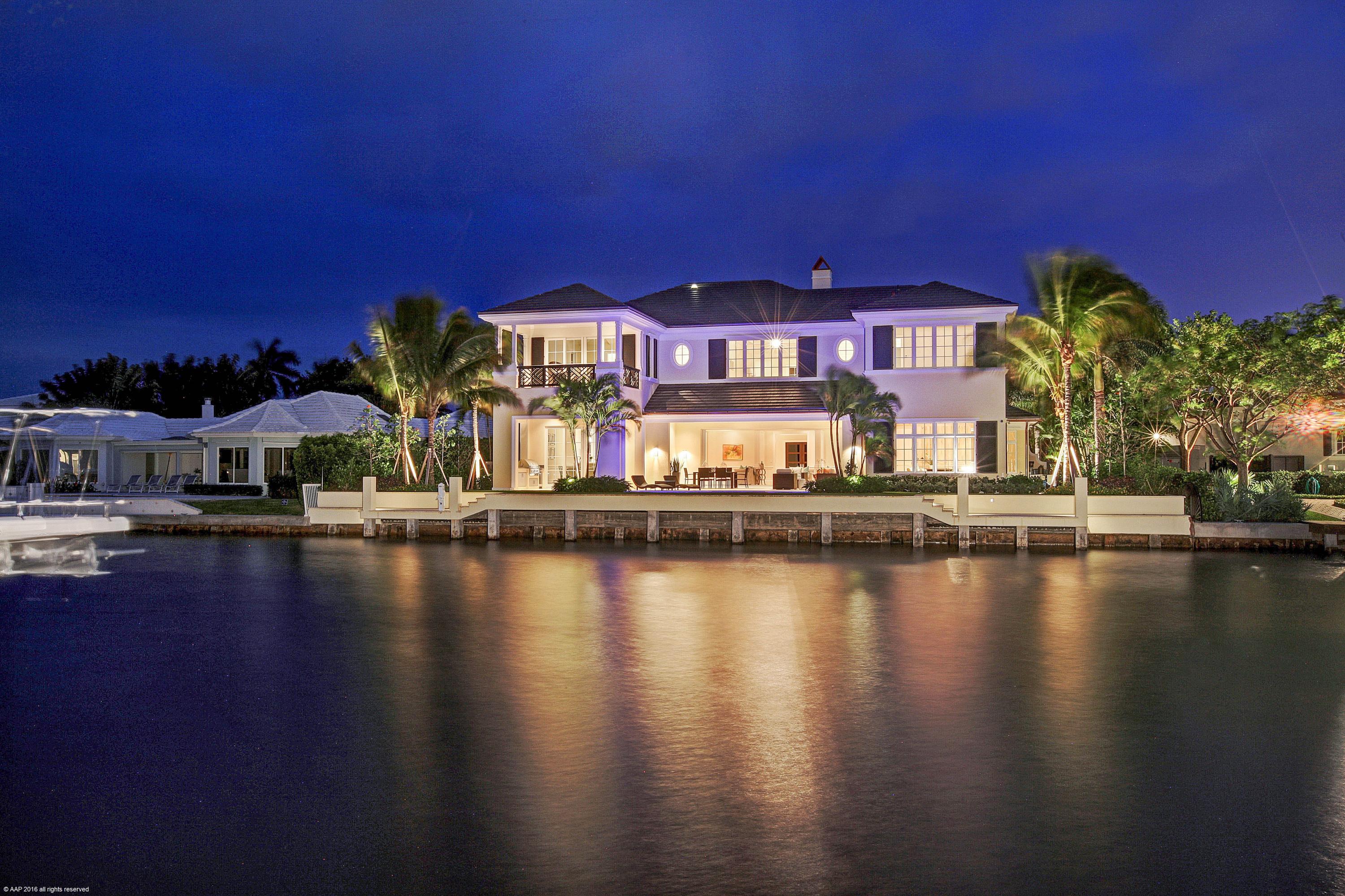 Sweeping Intracoastal views , protected dockage, superior style and construction, and a prime location on one of Delray Beach’s finest streets is offered in this brand new four bedroom, five and one half bath home. Nothing has been overlooked in this gracious, yet comfortable home, situated conveniently close to the beach and Atlantic Ave. See Broker remark Offering an excellent floor plan with an impressive foyer, stunning great room with fireplace, Cypress paneled library/media room, gourmet chef’s kitchen, an ideally situated dining room, a large bedroom suite, serving as a second master/VIP suite, expansive loggia, and separate summer kitchen, all leading to lush gardens, deck, pool and dock with breathtaking Intracoastal views. This home is built to perfection for outdoor living entertaining.
On the second floor, the exquisite master suite provides expansive views of the Intracoastal from the private covered porch, a large living room, two additional bedroom suites, and a laundry room. Built for the most discerning buyer, attention to detail is apparent with custom finishes and extensive millwork throughout. Walnut hardwood floors, designer tile and stone counters, Dominican coral pool deck and loggia, recessed sliding doors, custom cabinetry, whole house generator, 80' concrete dock with facilities, and structural upgrades throughout make this an exceptional home.

The architectural design and spectacular views have to be seen to be appreciated. This brand new residence is a treasure...perfectly positioned for peace, privacy and an easy, relaxing lifestyle in Delray Beach's most sought after neighborhood.