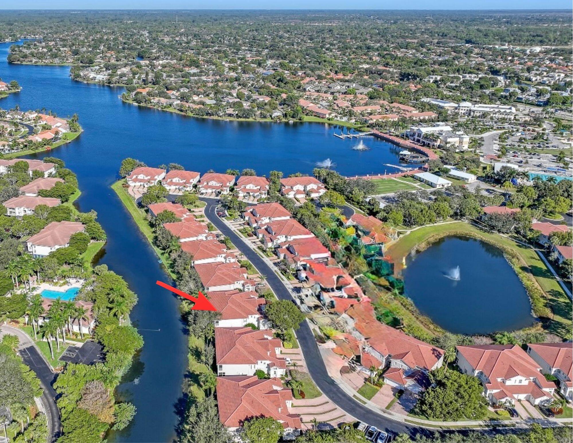 Handyman Special with Incredible Potential! Located in the highly sought-after gated community of Mayfair on Lake Wellington, this waterfront first-floor coach home offers 3 bedrooms, 2 baths, and a 1-car garage with a spacious and desirable 3-way split bedroom floor plan—perfect for privacy when family and guests are visiting. The primary suite is generously sized and features a large walk-in closet, additional wall closet, linen closet, dual sink vanity, oversized Roman soaking tub, and a separate walk-in shower for added convenience. The home also offers an eat-in kitchen with a pass-through window to the dining area, an interior laundry room, and exterior storage space. The community replaced the roofs and did exterior painting of all units in 2024 Enjoy peaceful water views from this well-positioned unit while adding your own personal touches and updates to make it shine again. Mayfair on Lake Wellington is a gated 55+ community offering wonderful amenities including a clubhouse with kitchen, fitness center, heated swimming pool, and social activities. Conveniently located in the heart of Wellington, residents enjoy being within walking distance to the Wellington Senior Center, Wellington Amphitheater, shopping, restaurants, and community events. Fantastic opportunity to create your perfect Florida retreat!