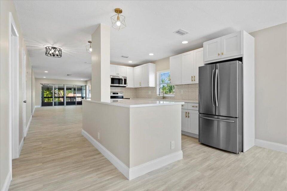 Welcome to this beautifully fully new renovated 2-bedroom, 2-bathroom condo, offering the perfect blend of modern upgrades and Florida charm. Nestled in a desirable neighborhood, this spacious unit features brand-new flooring, sleek kitchen finishes with stainless steel appliances, and stylish, contemporary bathrooms. The open-concept living and dining areas provide plenty of natural light, making the space feel bright and airy. Enjoy your morning coffee on the private balcony, or take a dip in the community pool just steps away. With fresh paint, upgraded lighting, and a washer/dryer in-unit, this condo is move-in ready and perfect for those seeking a low-maintenance lifestyle. Selling fully furnished. No assessments.