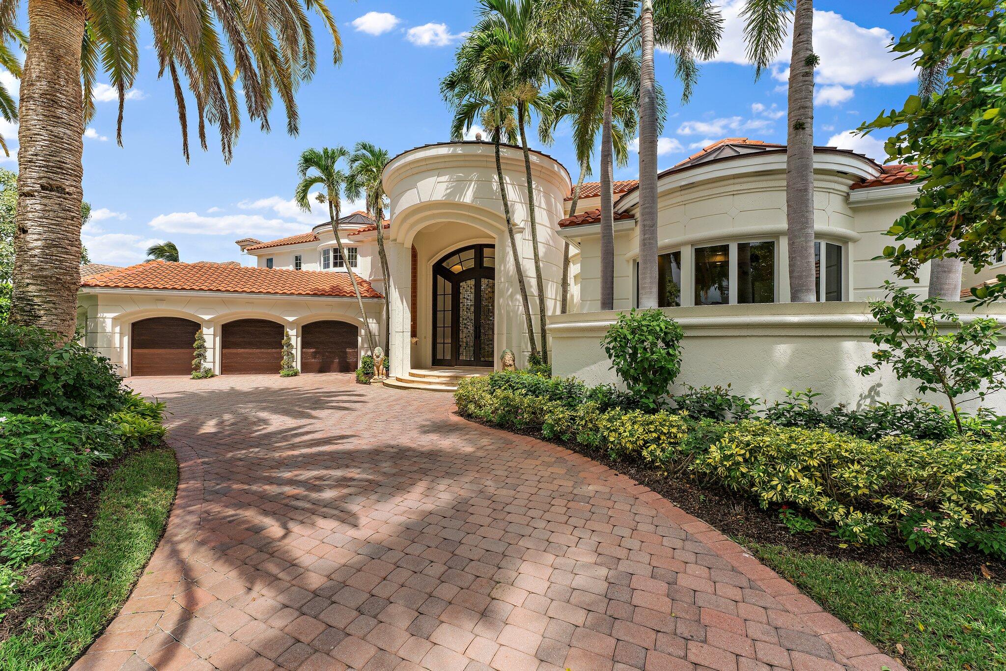 Rarely available stunning custom home in St Thomas at BallenIsles Country Club. Spanning approx 6,500 sq ft of living space, this residence features 5 beds, 5.1 baths, office, soaring ceilings, abundant natural light, new LED lighting, and 2020 roof, all set on a spacious, private lot. Impressive 12 ft doors welcome you to a magnificent foyer, leading to the living room with a dual-sided fireplace. The master suite features an oversized bedroom with a sitting area, his and hers walk-in closets, dual sinks and water closets. Kitchen and family room boast soaring ceilings, a sunken bar, and private wine cellar, offering ample space for entertaining. The grandeur extends onto the patio, summer kitchen, and pool area. Must see to appreciate