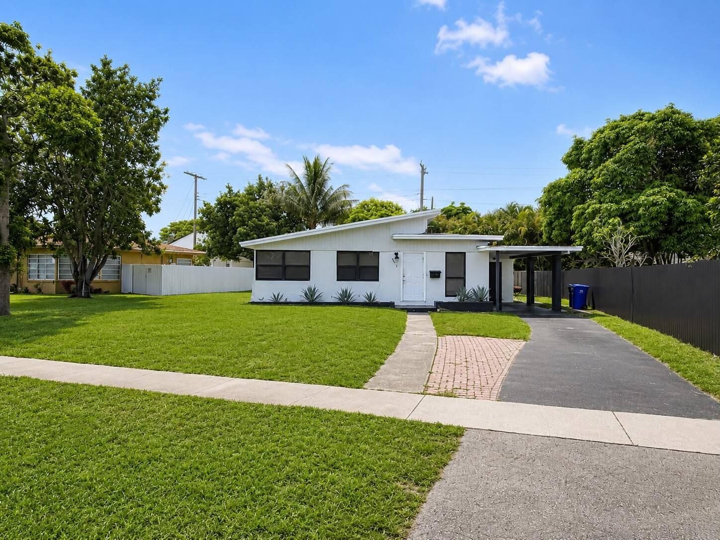 Best Value in the Neighborhood! Completely remodeled! 3 Large bedrooms (den converted to large bedroom off the living room) plus 2 full baths all redone with gorgeous new tile showers. New tile floors throughout entire home & brand new kitchen with stainless steel appliances & entry from carport! Carport also features a separate laundry room! Extra long driveway for ample parking + park your RV or boat on the side. NO HOA! NEWER CENTRAL AC & NEWER ROOF! Partial new windows in master and 3rd bedroom. This home sits on a large 7500 SF lot on a quiet and charming street. Backyard is fenced for your privacy. Don't miss this beauty! Priced to sell!