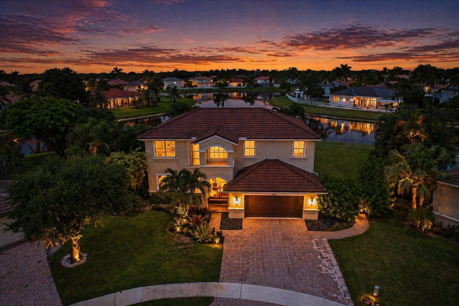 Lakefront living on an oversized cul-de-sac lot in Journey's End! Offering nearly 200 feet of waterfront, this fully fenced property features sunset views, a heated pool, gazebo, and fire pit. Interior features porcelain tile flooring, high ceilings, quartz waterfall island, stainless steel appliances, and high-end finishes throughout. Spacious upstairs den can serve as a 5th bedroom, office, or private suite. Includes 7.7 ft hurricane-impact double front doors, accordion shutters, new 5-ton A/C with UV light and smart thermostat. Journey's End offers a clubhouse, pool, fitness center, tennis, pickleball, basketball, playground, and 24-hour manned gate.