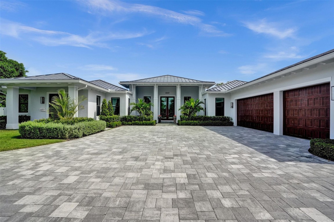 This stunning newer construction home offers sweeping views of the exclusive Coral Ridge Country Club golf course. Situated on the 11th tee, watch the sunsets from your beautiful backyard complete with outdoor kitchen, firepit, large covered patio, pool, and spa. The bright and spacious primary suite offers views, two large walk in closets, and an elegant customized bathroom just made for luxury and relaxation. En suite bathrooms in every bedroom and each one built with individual touches . Every detail throughout this home has been meticulously designed, with stunning built-ins that add both functionality and elegance to every room—even the 3 car garage! Ideal for entertaining, unwinding, or embracing the Coral Ridge golf lifestyle.