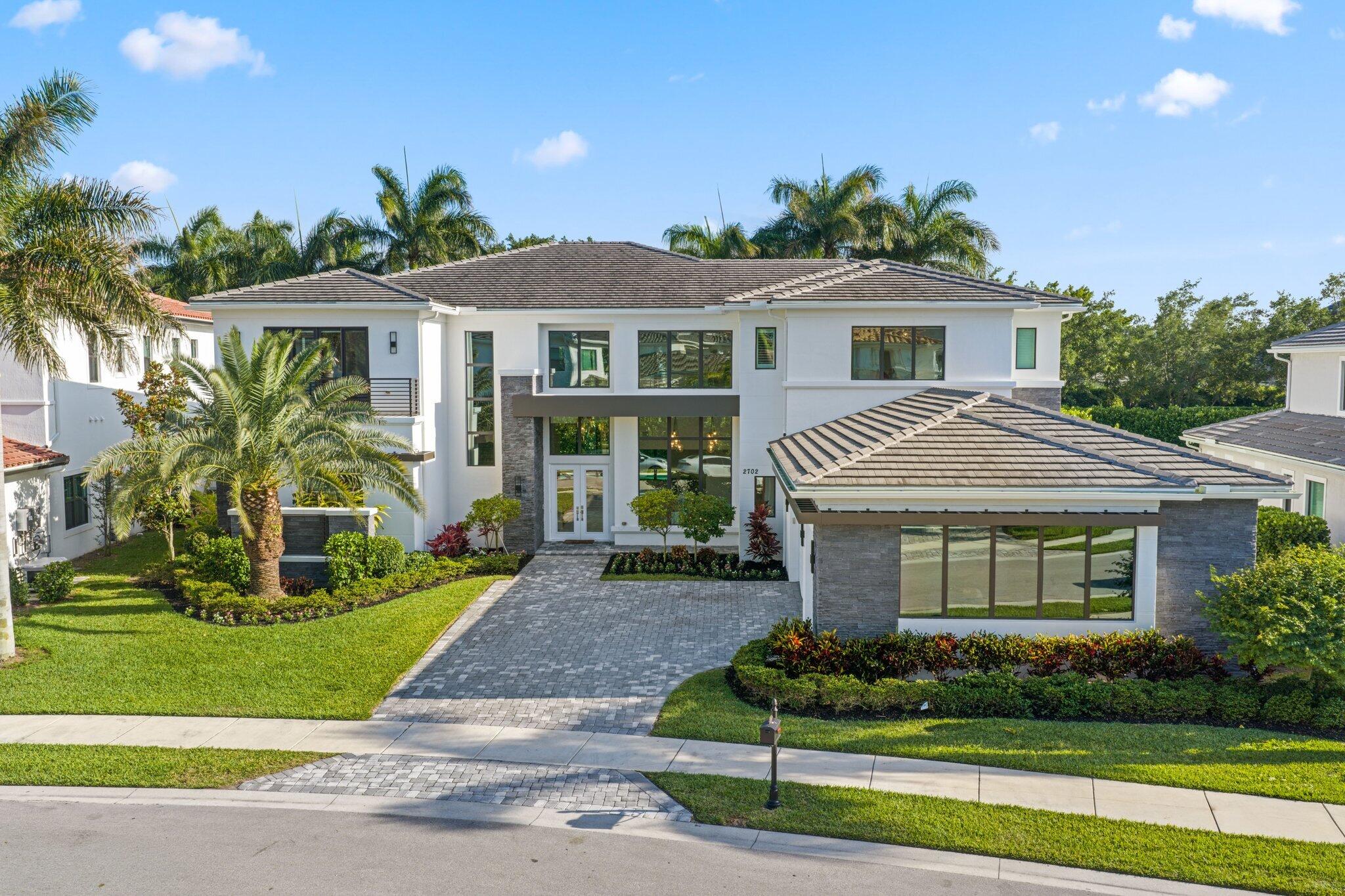 Located within the Signature Collection at Royal Palm Polo, this extraordinary estate showcases 7,437 SF of refined luxury living. Designed for both entertaining & comfortable everyday living, the residence features 7 bedrooms, all with en-suite bathrooms & a gourmet chef's kitchen appointed with Wolf & Sub-Zero appliances, complemented by an expansive bar area. Seamless indoor-outdoor living defines the home, highlighted by a first-floor primary suite, an upstairs Jr suite & a home theater. A dramatic great room with soaring ceilings, along with spacious living & dining areas, opens effortlessly to the outdoor entertaining space. This home also includes a full-home generator. Enjoy the South Florida lifestyle with a heated pool, outdoor kitchen & covered lanai. Royal Palm Polo, a prestigious gated community developed by Toll Brothers, offers residents access to an array of upscale amenities including a private clubhouse, state-of-the-art fitness center, resort-style pool & spa with shade cabanas, six Har-Tru tennis courts & a children's playground. Ideally located near upscale shopping, fine dining, major roadways, A-rated schools & pristine beaches.