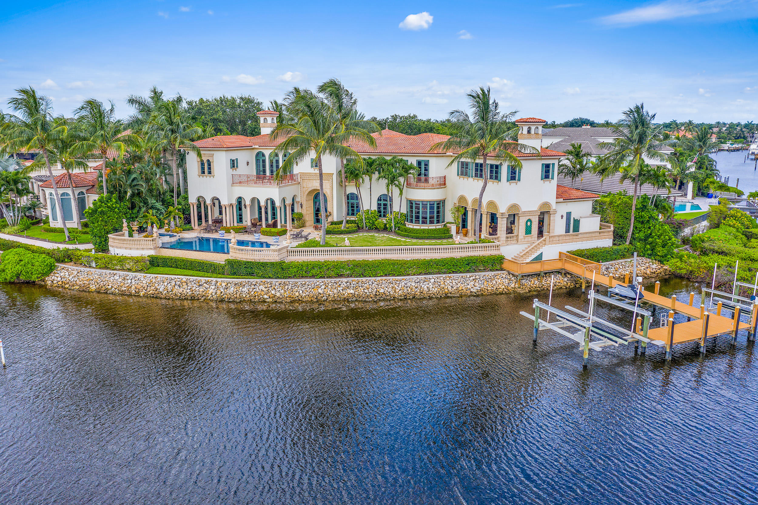 A true masterpiece built by Turtle Beach Construction awaits you.  This custom built, thoughtfully designed home has everything one could want. There are multiple places to entertain from the club room with a built in bar to the open great room adjoined to the gourmet kitchen, theater room and summer kitchen that leads to the amazing outdoor space that has spectacular sunsets.   You will want to spend countless hours taking in the water views relaxing by the infinity edge pool that feels like it cascades into the panoramic waterway and in the distance a bird sanctuary that is memorizing.    Grand formal space, solid marble columns, Venetian plaster, hand painted moldings, high end appliances, a guest house and so much more!  This home is sophistication and magnificence at it's best.