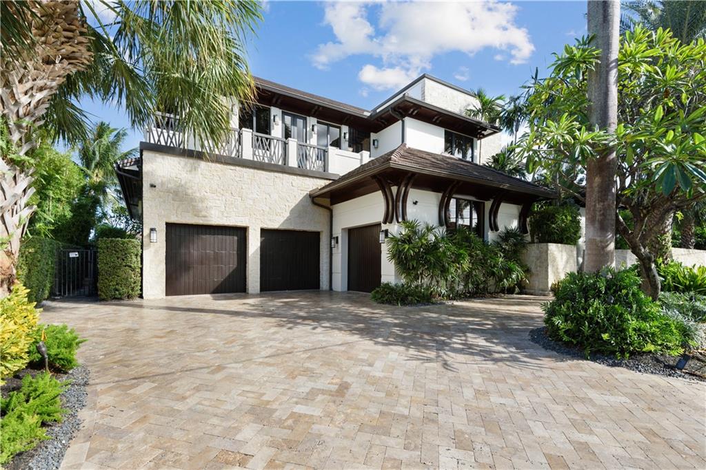 One-of-a-kind Balinese inspired contemporary home 2 from the point! Designed by Randall Stofft, this 3-story home has it all including elevator, temp controlled wine room, man-cave/office, wet bar, Butlers pantry, mudroom, & 3-car garage w/room for lifts. Enjoy cooking+entertaining in this gorgeous kitchen, fully equipped w/custom cabinetry, double island, granite countertops, Wolf & Sub-Zero appliances. Oversized master w/morning bar, master bath w/water views, 2 showers & dual vanities. Move-in ready w/Crestron Smart Home lighting, Security & Sonos music systems that can be controlled remotely. Your outdoor oasis awaits w/salt water infinity edge pool, concrete dock to accommodate up to an 80' boat, outdoor kitchen, cabana bath, custom landscaping, outdoor shower & speakers. A must see!