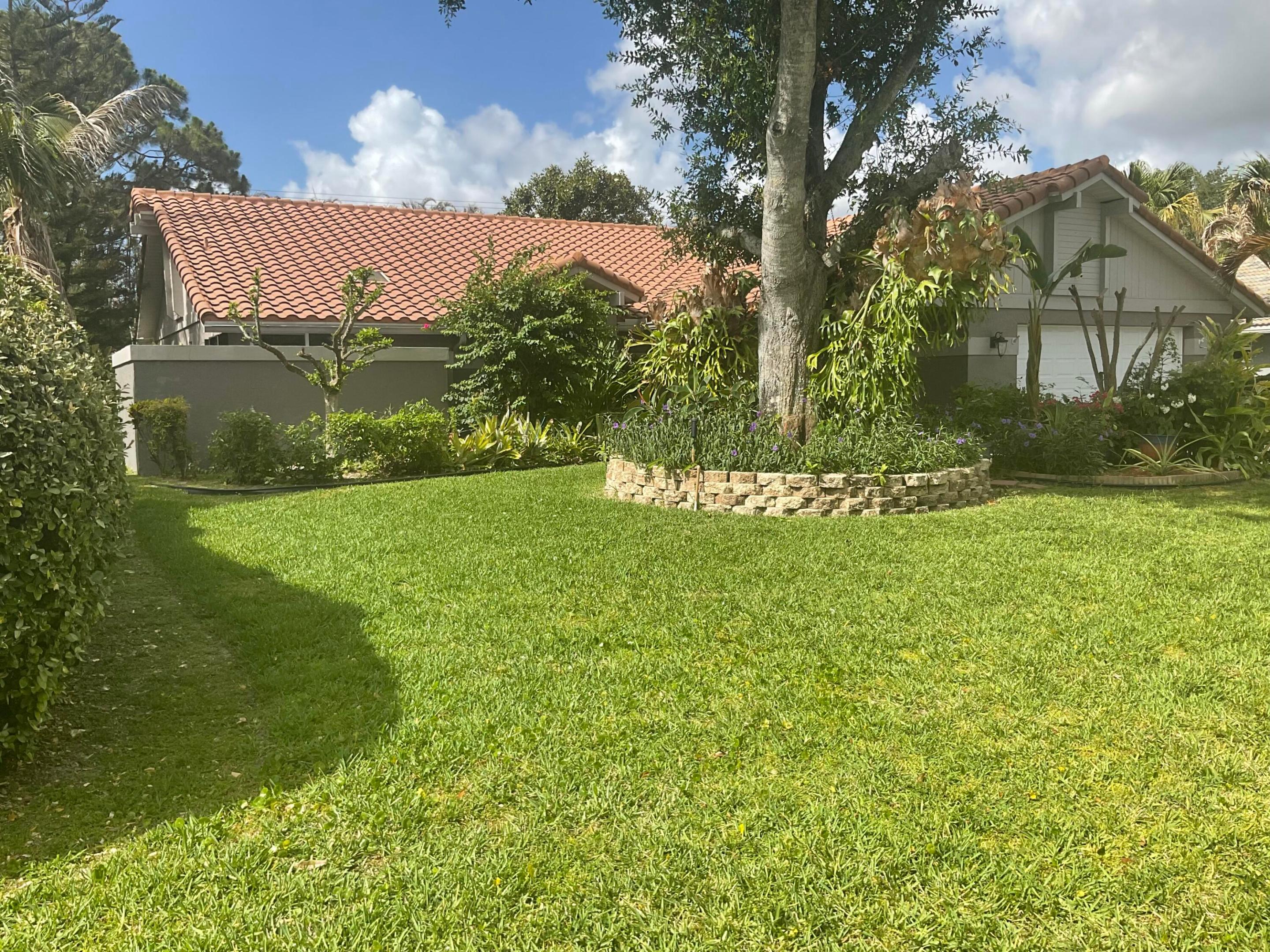 DISCOVER THIS INVITING 3 BEDROOM, 3 BATH HOME NESTLED IN COUNTRY CLUB ESTATES ENJOY A PRIVATE CORNER LOT,  GRACED BY LOCAL BIRDS AND DUCKS. THE PROPERTY BOASTS MATURE LANDSCAPING AND A GENEROUS COVERED OUTDOOR ENTERTANMENT AREA, COMPLETE WITH A SOLAR- HEATED POOL FOR YEAR-ROUND ENJOYMENT. FOR ADDED PEACE OF MIND, THE HOME FEATURES A GAS TANKLESS WATER HEATER,STOVE AND DRYER, PLUS  IMPACT WINDOWS WINDOWS AND FULL PATIO  SHUTTERS,  RECENTLY INSTALLED  A/C SYSTEM.  THE SPRINKLER SYSTEM HAS BEEN NEWLY REDONE FOR EASY UPKEEP. THIS LOCATION OFFERS CONVENIENT ACCESS TO  SCHOOLS,   SHOPPING AND MEDICAL FACILITIES. AS PART OF A DESIRABLE GOLF COURSE COMMUNITY, RESIDENTS CAN ENJOY MEMBERSHIP OPTIONS & A CLUBHOUSE W/RESTUARANT AND ENTERTAINMENT VENUES OPEN TO THE PUBLIC.