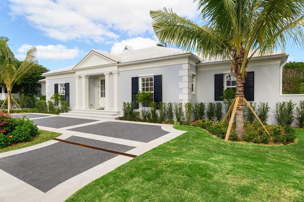 Exquisite custom one story estate residence on prestigious Sandpiper Lane just steps to the beach or the bike trail. Soaring ceilings in every room – with a special barrel vault in the grand living room. Formal dining with casual dining in the custom chefs kitchen. Oversized family room and four spacious bedroom suites – the master has separate his/her baths detailed in marbles with polished nickel fittings. This home has a rare rear alleyway allowing the garage set up in the back – with a circle drive for ample guest parking in the front. The entire rear yard is walled/fenced and lushly landscaped for total privacy when enjoying continuous ocean breezes or the pool. Totally separate guest house with full bath, its own laundry room, and kitchen – perfect for guests, mother-in-law or lucky staff. Classic architecture with generous use of moldings, large foyer, library, and ample storage. Light hardwood flooring and marbles lead to a precast coquina pool deck and loggia. Tired of stairs and small rooms? This home is the perfect antidote - generous proportions and all on one level!