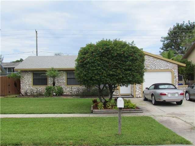 WOW, Here is the nice home in a friendly neighborhood, which is close to everything! This home has been upgraded with impact glass, has a super, light and bright large rear family room with soaring ceilings. French doors lead to a an adorable backyard, appointed with an adorable gazeebo and plenty of room for a pool. There are no laundry machines in the garage or air handlers in a bedroom closet, for this home has an indoor laundry/utility room. Open Showings Today, Sunday:12:30-3pm