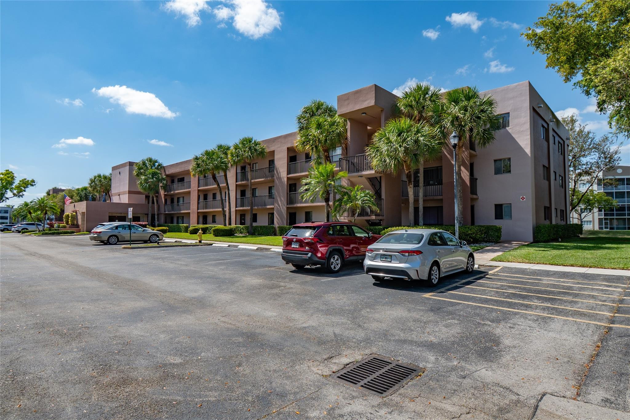 Discover this beautifully updated 2/2 condo in Ashmont at Kings Point, a premier 55+ community in Tamarac! This top-floor (3rd) corner unit offers breathtaking lake views to the North, showcasing both sunrises & sunsets with the sun always behind you. Enjoy a custom-updated kitchen & bathrooms, meticulously designed & executed, plus new full-Size washer & dryer, new stainless steel appliances, new water heater, newer AC, under-sink water filtration and a screened balcony to soak in the serene surroundings. A short walk to the community pool, plus easy access to Kings Point's incredible amenities, including a theatre, heated pools, fitness center & courtesy busses plus a wide variety of social activities ad more. Parking spot next to elevator.
