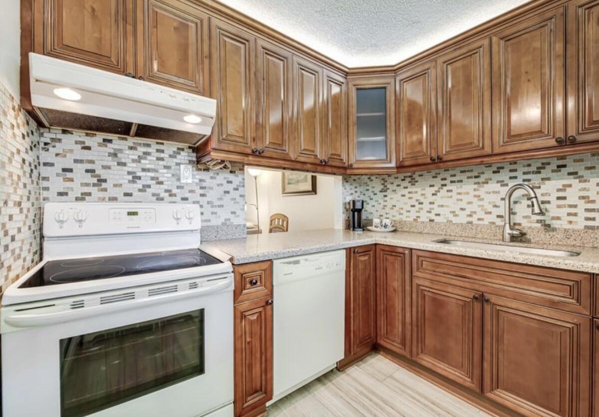 Welcome to this beautifully updated & fully furnished condo in the Pristine &  conveniently located 55+ community of Lake Clarke Gardens in the Heart of Lakeworth Beach. This inviting unit offers comfortable living in Sunny Florida at its best. Enjoy the Resort Style community with an impressive array of amenities that include 2 heated pools, sauna, fitness center, billiards, 2 BBQ areas, bocce ball, shuffleboard, cards room, library, putting green as well as community activities and recreation. This community is a prime location for shopping, restaurants, supermarkets and much more. Palm Beach Airport and the Beach within a 15 minute drive. HOA Fees include Water, Cable, High Speed Internet, Building Insurance, Maintenance of Common Areas, Pest Control & Courtesy Bus to local shopping.  Flooring throughout is Waterproof Luxury Vinyl