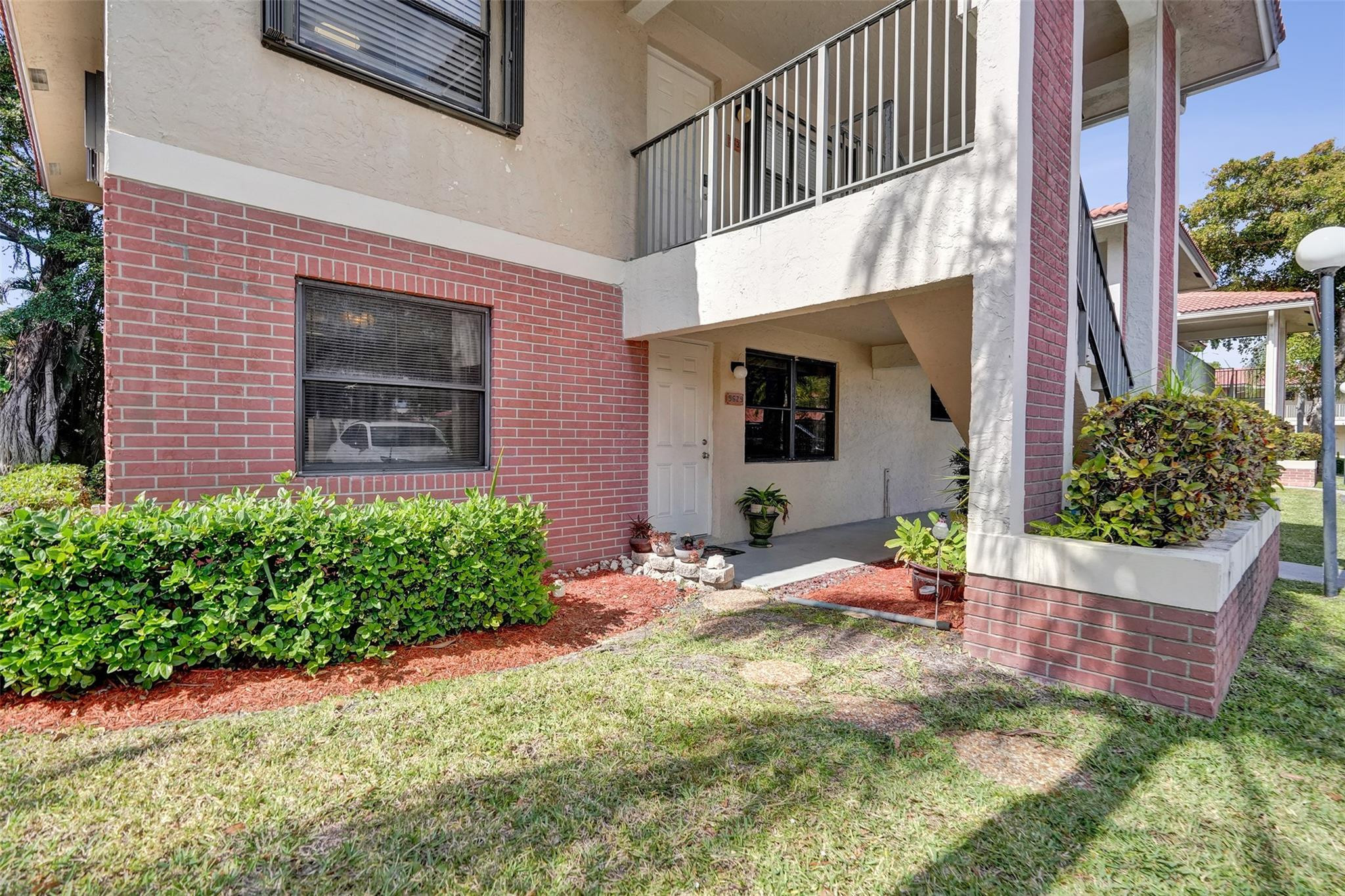 Welcome to your new home in the heart of Coral Springs! This beautifully maintained 2 bed, 2 bath corner unit offers first-floor entry within 10 feet of your parking space for ease of access. Enjoy your morning coffee on the serene, screened-in patio overlooking lush greenery. The spacious primary bedroom features a walk-in closet and private ensuite bathroom. Washer and dryer in unit for added convenience. Lounge by the pool and enjoy a sunny afternoon or explore nearby favorites like Coral Square Mall, The Walk, or a plethora of parks to choose from. Close proximity to Sawgrass Expressway, as well as multiple highly rated schools. Association fee includes lawn maintenance, common areas, master insurance, water and trash. VA APPROVED CONDO!! Schedule your private tour today!