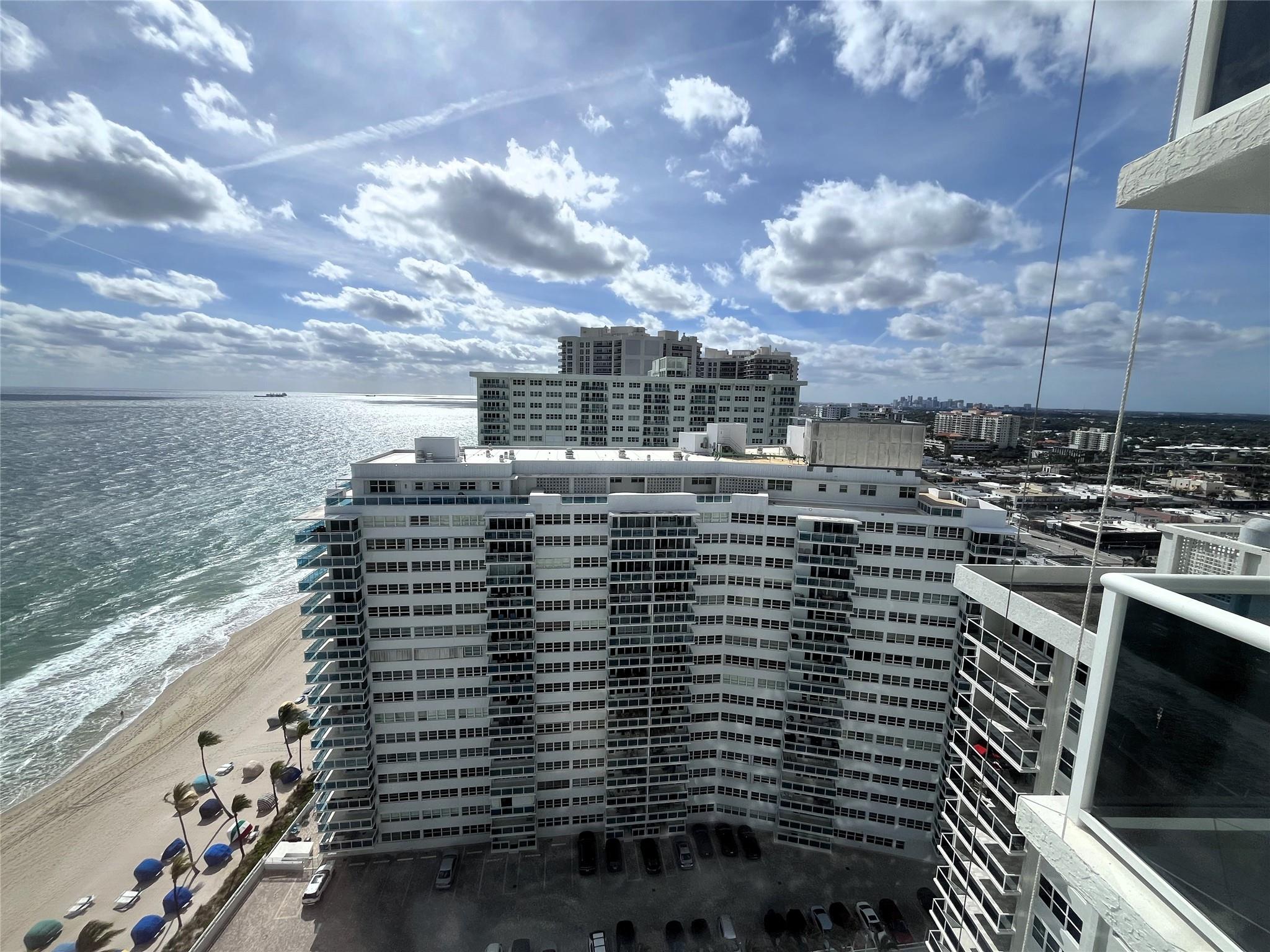 Completely remodeled with great SE ocean views and city views. Tile floors throughout. Crown molding. Split bedroom floor plan. Master bathroom features a step-in shower. Bathtub in guest bathroom. Open balcony w/ ocean & pool views. Balcony/Concrete restoration is occurring so use of balcony and view from balcony may be limited at times. Elevators and roof restoration are also scheduled. Deeded garage parking. Washer & dryer inside condo. Large balcony. Located in prestigious Playa Del Sol. Building offers great amenities including heated pool & two exercise rooms. Southeast Florida living at its finest! Information is deemed to be reliable, but not guaranteed.