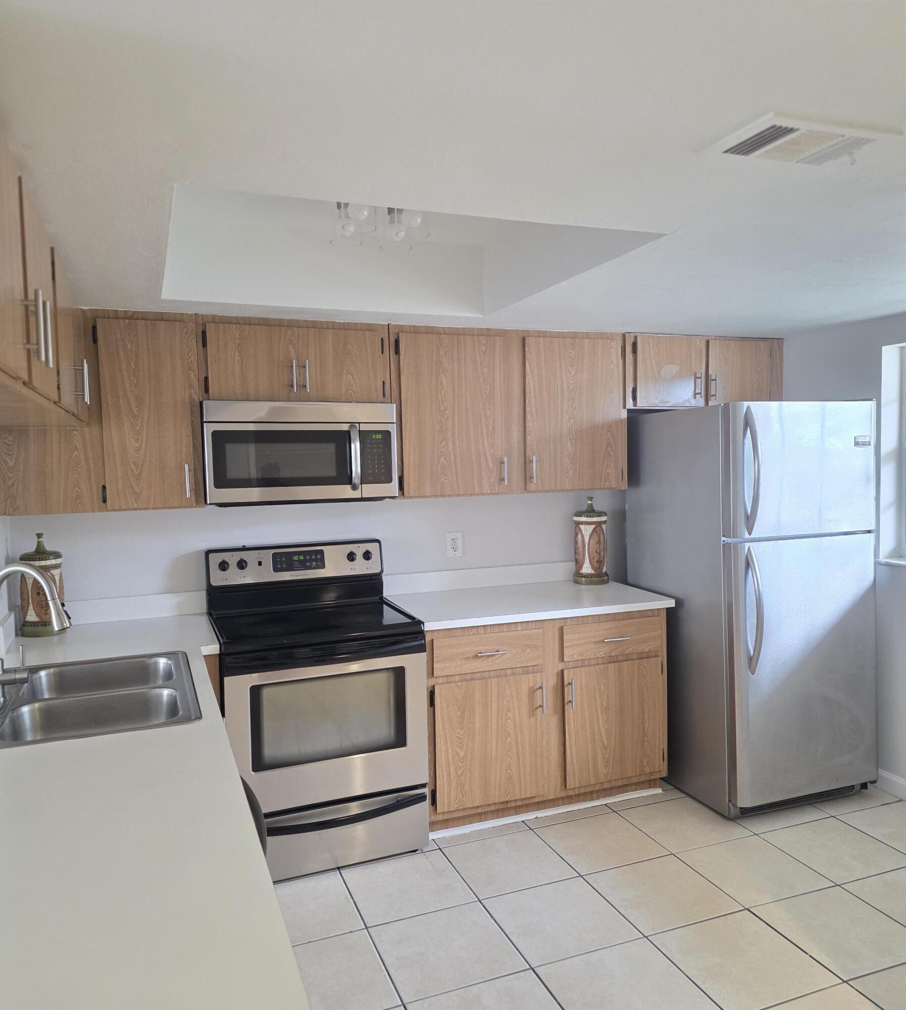 Beautiful 2BR/2BA first floor condo in Palm Beach Trace with 1,201 sq ft of bright, open living space. Features include a split bedroom layout, spacious 20×12 living room, walk in closet, ceramic tile flooring, central A/C, and in unit washer/dryer. Community offers a pool and guest parking. 1 pet up to 25 lbs allowed (fee applies). Close to shopping, parks, and top rated schools.