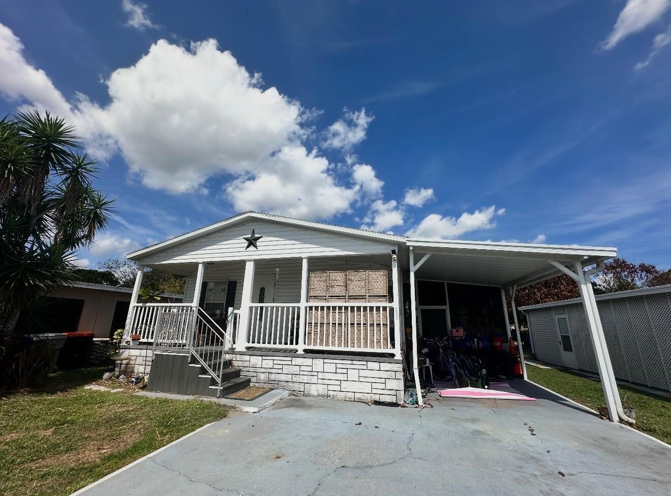 harming 2-bedroom, 2-bath manufactured home in the desirable all-age community of Lakewood Village in Vero Beach! This well-maintained 1,056 sq. ft. residence (built 2006) offers comfortable living with an open layout perfect for relaxing or entertaining. Enjoy the family-friendly, pet-friendly park atmosphere with great amenities, low lot rent, and convenient access to beaches, shopping, and dining. The home will be updated prior to closing with brand new flooring throughout and freshly painted walls for a move-in ready feel. Don't miss this affordable opportunity to own in one of Vero Beach's most welcoming all-age communities, schedule your showing today!  More pictures to come!