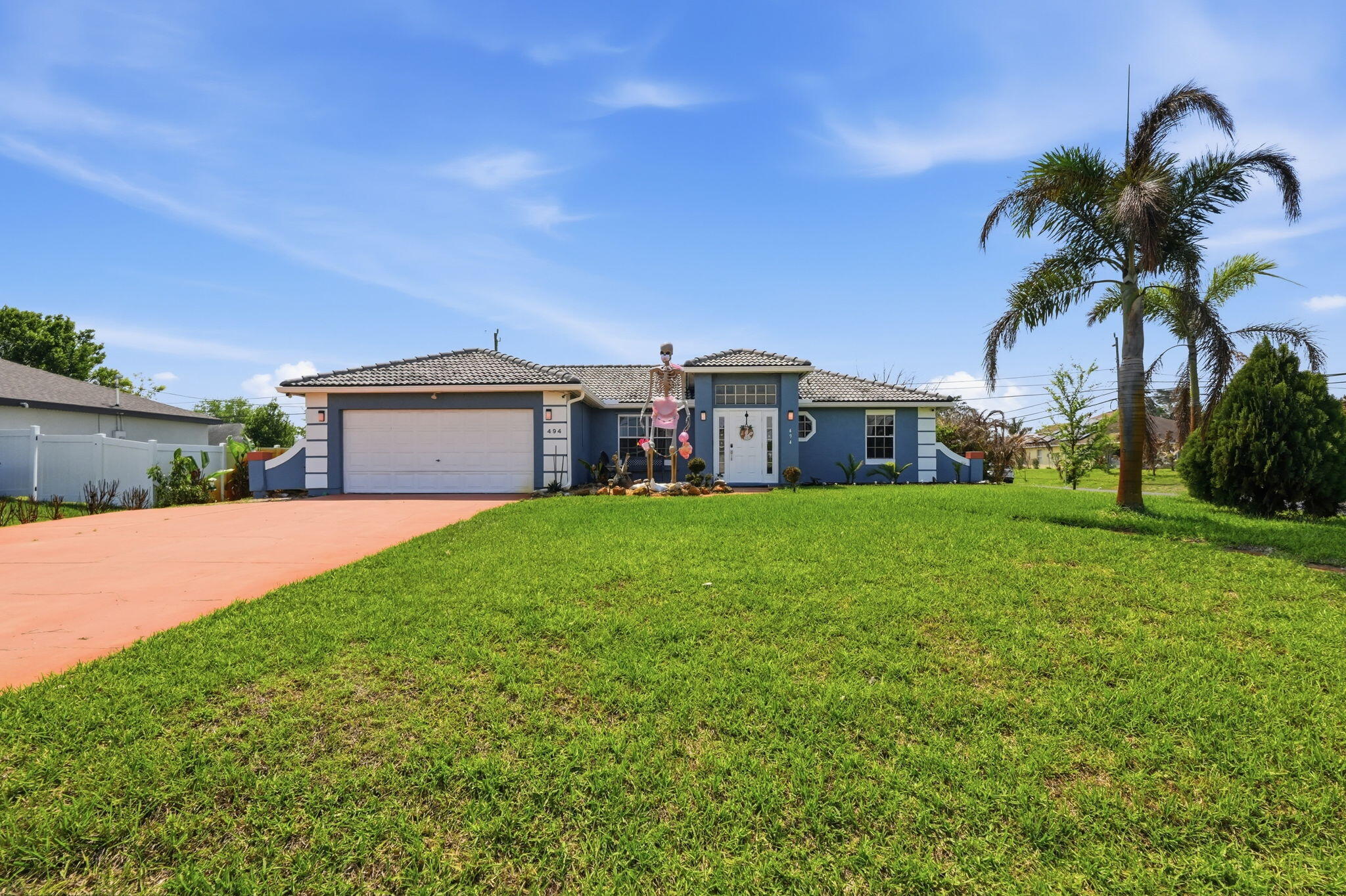 Beautiful 3-bedroom, 2-bath home with a fully fenced backyard and numerous upgrades. Features include new kitchen cabinets and new Samsung appliances, A/C replaced in 2021 with new handler in 2025, and a 2021 water heater. Equipped with whole-house solar panels, a 2-year-old well pump, built-in electric fireplace, and a well-supplied sprinkler system. 2nd bathroom includes a jacuzzi tub. Outdoor highlights: pagoda with furniture, above-ground pool with equipment, grilling station with KitchenAid and Expert grills, fire pit, and 10x20 shed. Enjoy a variety of fruit trees including mango, avocado, jocote, guanabana, plantain, banana, acerola, mulberry, annona, and peach. Solar panels (owned) whole house (AC between 70 - 72 degrees w/winter bills $30-40/mo and summer under $100). Seller to pay balance owed at closing (attached to non-ad valorem taxes).