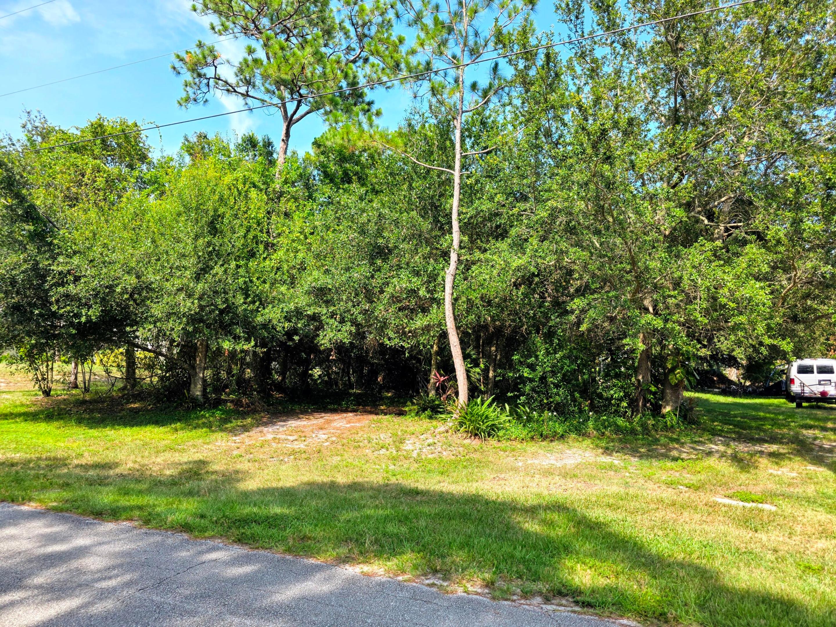 PRIME PORT ST. LUCIE LOT! Ready to Build your Dream Home? This Excellently Located, High and Dry Vacant Lot is already Partially Cleared and Offers Unbeatable PRIVACY. Enjoy Beautiful Nature Views with a Park Sitting Directly Across the Street. In the Rear, a Drainage Canal Provides a Fantastic Natural Buffer, Meaning no Immediate Backyard Neighbors! This is a RARE Find Offering Built-in Privacy on Both the Front and Back of your Future Home. Great Location Close to Everything. Bring your Floor Plans and MAKE IT YOURS!!