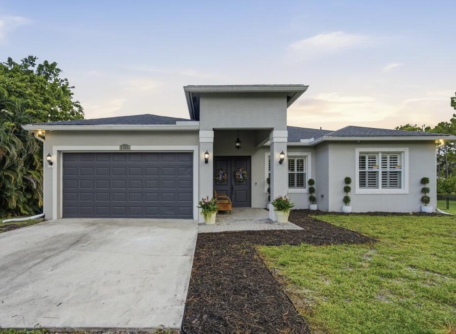 WELCOME HOME! Built in 2016, this stunning 4-bedroom, 2-bathroom home offers the perfect blend of modern design, comfort, and privacy on 1.15 acres.  Step inside to discover an open-concept floor plan filled with natural light, spacious living areas, and stylish finishes throughout. The kitchen features ample cabinetry, generous counter space, and seamless flow into the dining and living areas—perfect for both everyday living and entertaining. The spacious primary suite has a double vanity, soaker tub and shower, while three additional bedrooms offer flexibility for family, guests, or a home office. The home features a brand new A/C system with 3 zones, whole house camera system, plantation shutters, reverse osmosis system, & so much more. Schedule your showing today, this won't last long!