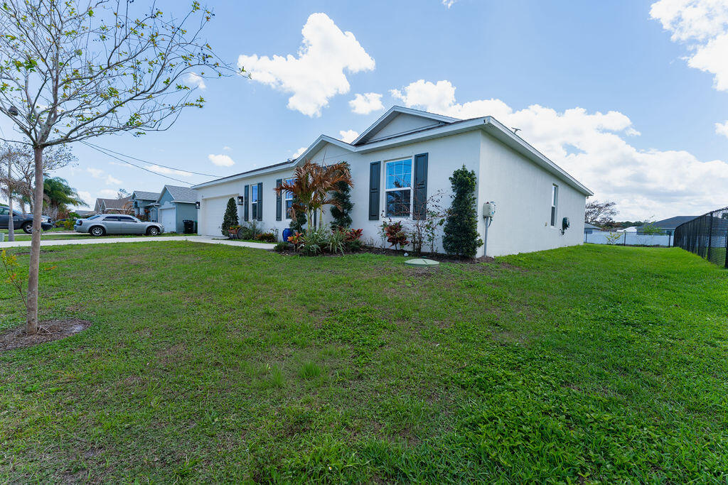 Welcome to this 4-bedroom, 2-bathroom single-story residence in Port St. Lucie Section 13, offering 2,059 square feet of finished living space. This waterfront property combines comfortable residential living with the appeal of water views and access with close proximity to Marinas, providing a distinctive setting for those seeking a unique home environment. The residence features a 2-car garage for convenient parking and storage. The thoughtful floor plan and generous square footage create versatile spaces suited to various living arrangements and needs. Located in the established Port St. Lucie community, this home presents an excellent opportunity for someone looking for waterfront living.