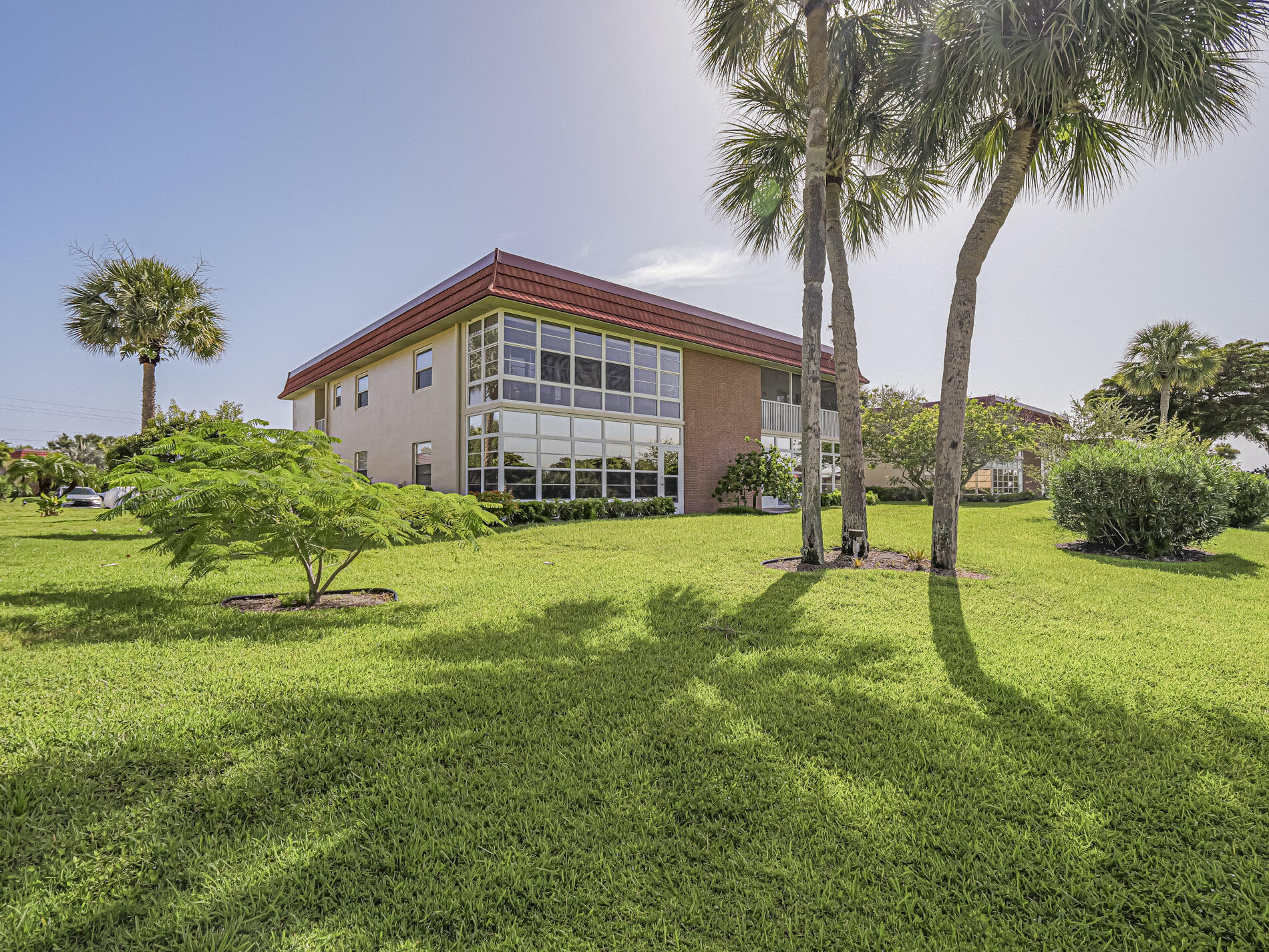 Golf + water views from this completely redone, fully furnished 2/2 "B plan" end unit with lots of natural light and IMPACT WINDOWS in front (not on lanai/sliders). Lovely space features upgraded tile floors, modern kitchen with granite counters and newer appliances + pantry. 2018 A/C. Split plan, air conditioned/titled back porch + master walk-in closet with closet organizers. Steps to clubhouse with amenities that include fitness, tennis, and more. Close to the river, beach, restaurants, shopping and more! This property has great rental potential with income of approximately ~$1,500/month.