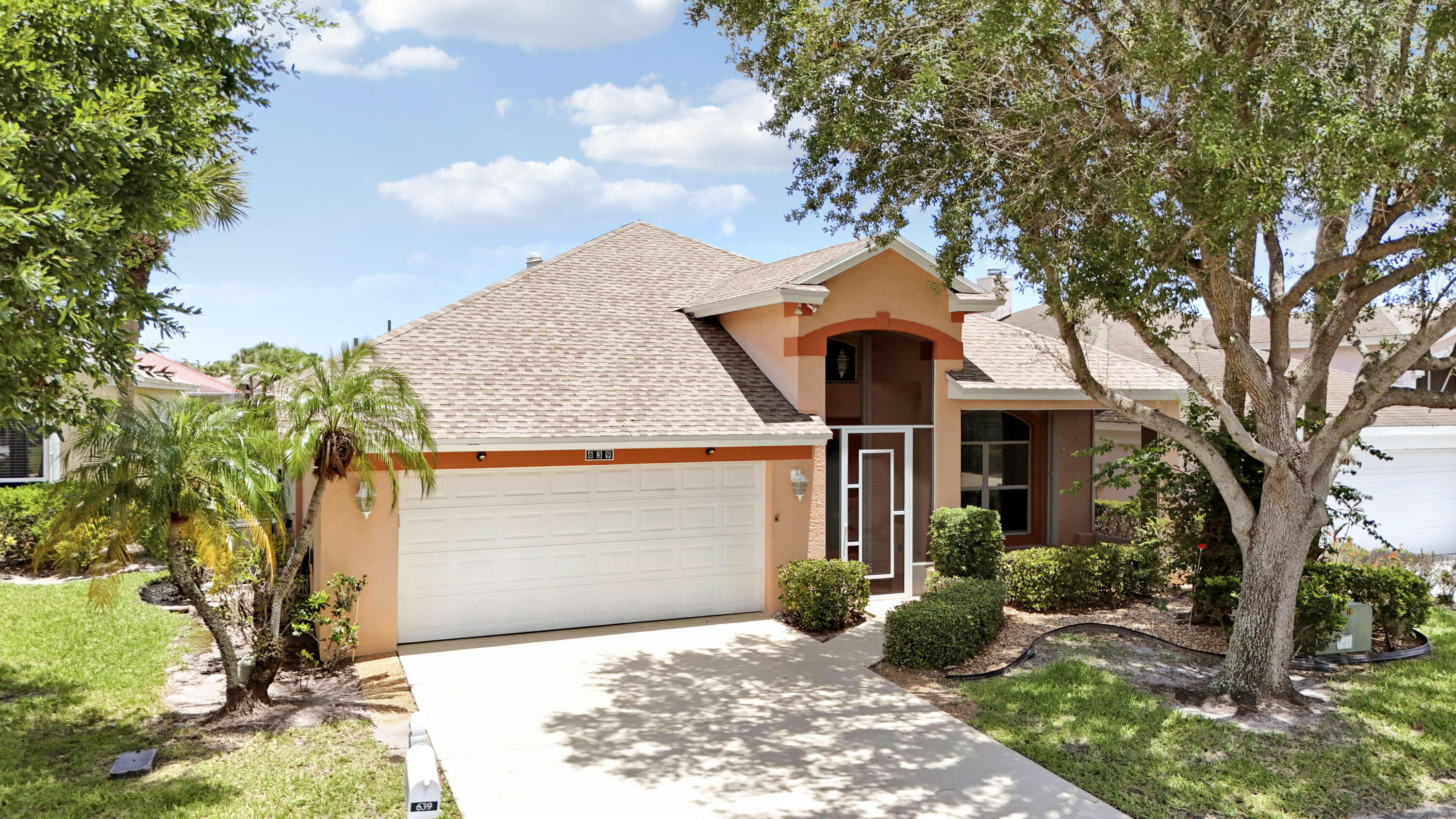 Lake views from this 3BR+Den/2BA/2CG Isle of Capri home with a BRAND NEW ROOF! Wonderful opportunity in the 55+ community of King's Isle, this Monte Carlo floor plan is nestled at the beginning of a cul-de-sac and is ready for its new owners. Upgrades include new roof (2026), accordion hurricane shutters, screened entry, fresh interior paint, new electrical panel, new SS kitchen appliances (2026), newer WH (2024), solid surface flooring t/o, spacious screened patio and more. The kitchen opens to the living area and has a plethora of white cabinetry, granite counters and breakfast bar. Split bedroom floor plan allows for plenty of privacy, The master suite has access to the patio as well as dual closets and attached ensuite bathroom.  Laundry room with utility sink and extra fridge! The screened and covered back patio is the perfect spot to lounge and relax while enjoying the water views. Ideally located on a side street with no passing traffic. HOA dues include basic cable, internet, manned security gate, common areas, lawn care and access to the amenity center (The Royal Club). Activities include resort style pool, pickleball, tennis, ballroom, gym, cards, social clubs, crafts and travel opportunities. Centrally located to everything Saint Lucie West has to offer and less than an hour to multiple airports. A short drive to dining, shopping, beaches and just minutes to the NY Mets Spring training facilities. Wonderful opportunity to own. Call today to view!