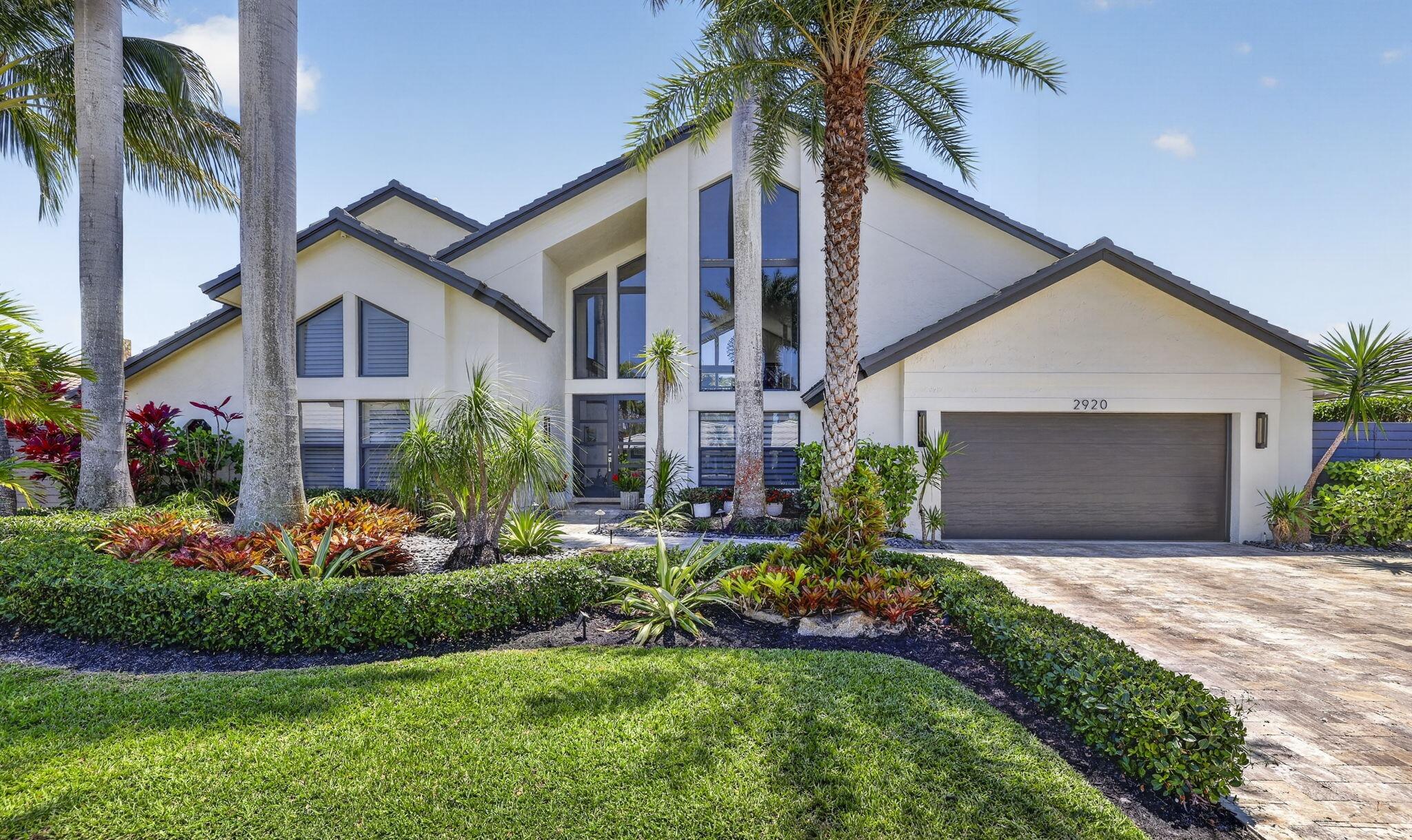 Exclusive Deep Water Elegance in prestigious Lighthouse Point on a highly desirable island street. 85' deep-water dock, no fixed bridges — direct ocean access between the Boca Raton and Hillsboro Inlets. Gourmet Chef's kitchen with Sub Zero & Wolf, soaring ceilings, abundant natural light, open floor plan, impact windows/doors, white oak floors on second level & staircase. Marble-paved backyard with saltwater heated pool/spa, outdoor shower, new summer kitchen (grill, bar seating, ice chest). Meticulously landscaped; dock & seawall updated 2019. Master suite with dual custom closets, oversized modern bath & loft; 3 beds downstairs + 2.5 baths. Owner Finacing Available. Showing by appointment only
