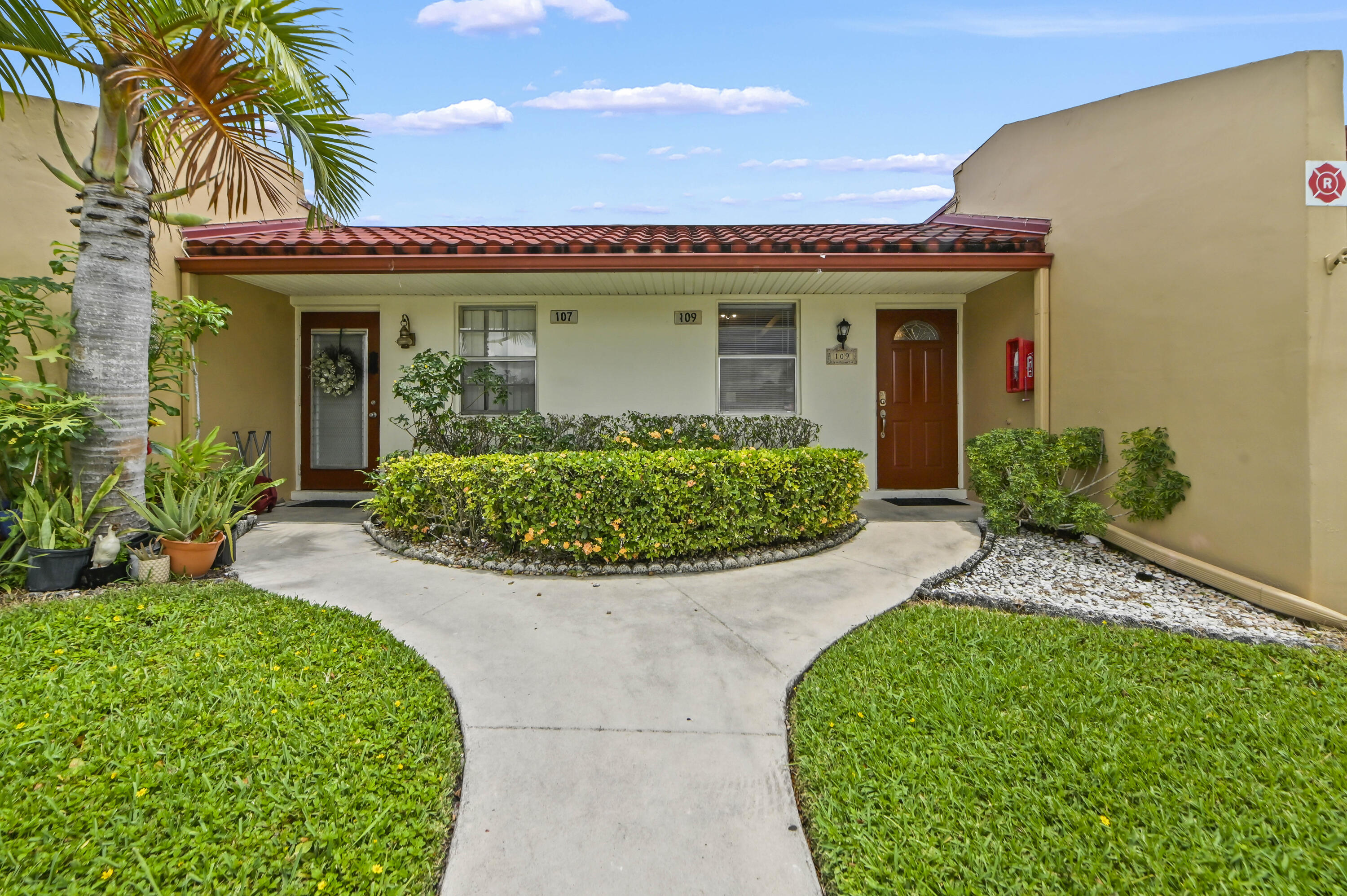 WELCOME TO GOLDEN LAKES VILLAGE CONDOMINIUM, a gated 55+ community offering comfortable waterfront living in the heart of West Palm Beach. This well-maintained lakefront condo features approximately 1,000 sq ft of living space with 2 bedrooms and 2 bathrooms.  Step through the welcoming foyer into a bright living and dining area, with tile flooring throughout the main living spaces. The kitchen is equipped with appliances and a convenient storage area for your everyday essentials. The primary bedroom includes a washer and dryer neatly tucked away in the closet for added convenience.  Relax year-round in the glass-enclosed sunroom/patio featuring hardwood floors and beautiful lake views, creating the perfect space for morning coffee, reading, or entertaining guests.  Residents of Golden Lakes Village enjoy a vibrant lifestyle with an array of social activities, clubs, fitness classes, water aerobics, card games, knitting groups, bingo, dances, shows, and organized trips. Conveniently located just 4 miles from Palm Beach International Airport and 7 miles from downtown West Palm Beach, the community also offers bus transportation for residents. Experience the perfect blend of relaxation, recreation, and convenience in this sought-after South Florida community.