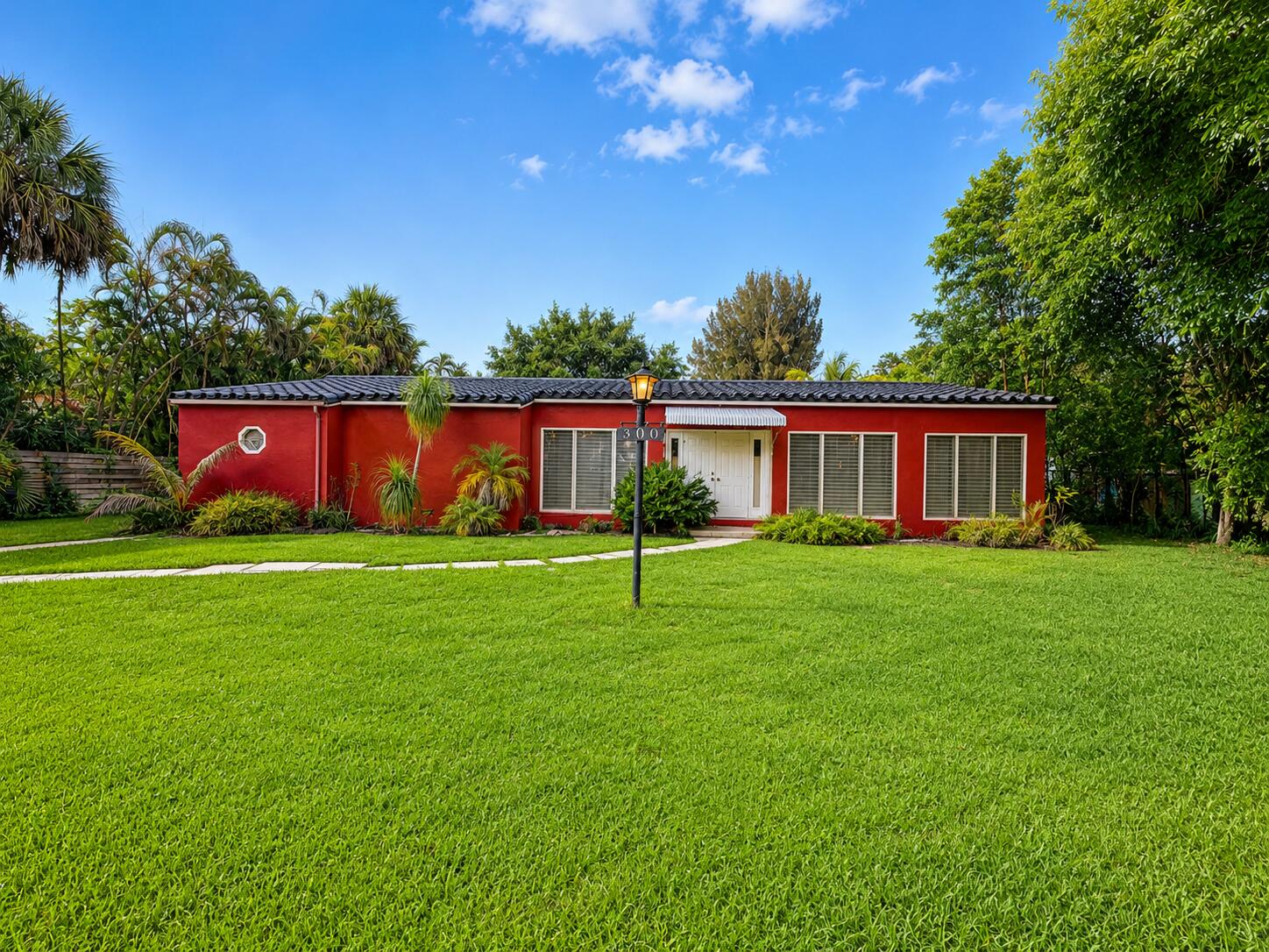 Rare 1-acre redevelopment opportunity in the heart of Plantation. Located on a quiet, tree-lined street with no HOA, 300 Bayberry Drive offers one of the most desirable buildable lots in the area. The existing home is being sold as-is and is considered a tear-down, creating a blank canvas for a custom estate or builder project.  Surrounded by established homes and recent luxury redevelopment, this oversized parcel provides exceptional privacy, flexibility, and long-term value. Enjoy a premier Plantation location just minutes from top-rated schools, parks, golf, tennis, shopping, dining, and major highways.  For buyers seeking a truly special homesite, opportunities like this are increasingly rare.
