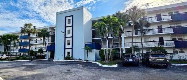WOW! Don't miss this beautifully furnished annual lease in highly desirable East Boca! The building's exterior renovation is now complete, adding to the appeal of this updated 2-bedroom, 2-bath residence with a versatile den/office and a sought-after split-bedroom floor plan in a secure, all-ages lobby building. The kitchen features extended cabinetry and a premium refrigerator, while the spacious primary suite offers an en-suite bath and a custom walk-in closet. Enjoy seamless indoor-outdoor living from the oversized screened patio—perfect for relaxing or entertaining. Additional highlights include an in unit full-size washer and dryer, utility room and impact glass windows throughout. Rent includes water, cable, and high-speed internet.