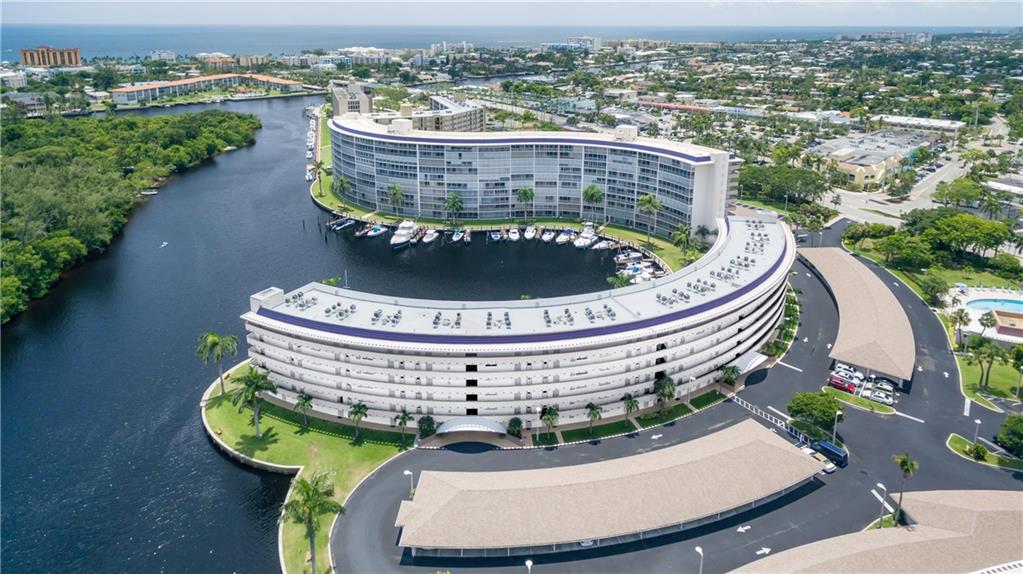 Ground floor condo with beautiful marina and water views.  Bright, white updated kitchen. Beautifully updated bath. Tastefully furnished (furnishings negotiable) All rooms have water view. A/C 2020. Bedroom has walk in closet. Patio runs entire length of apartment and overlooks preserve. No back neighbors, giving lots of privacy! Covered parking for your car and affordable dockage for your boat (when available.)  Close to the beach, shopping and restaurants as well as everything Deerfield Beach and the surrounding area has to offer! Hillsboro Cove is a wonderful community with amenities for full or part time living!