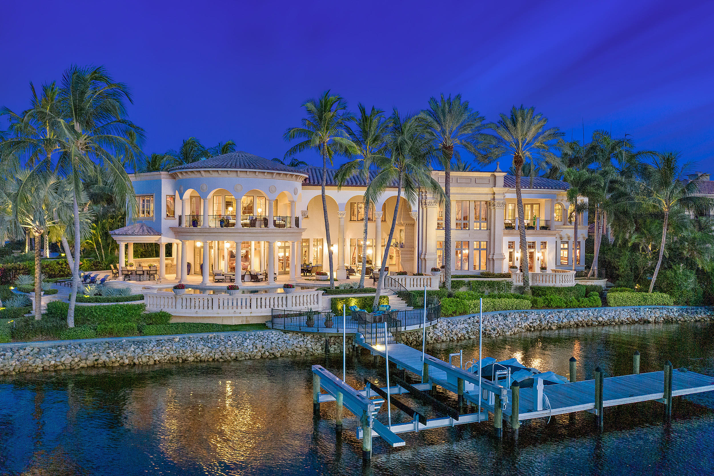 This stunning 5 BR, 7.1 BA  Admirals Cove estate sits on over 220' of panoramic water frontage. The ultra-desirable Intracoastal point lot is situated on water on two sides of the property with a protected dock for a large yacht. The property boasts state-of-the-art amenities  including a gourmet chef's kitchen, club room overlooking the water way, elevator, private guest suites, 3.5 car garage, impact windows and doors and generator. The unrivaled craftsmanship and exquisite details are prominent among the custom ceilings, stone floors, and sweeping majestic stairway. The Master Suite has his and hers closets and baths, wide water views and private balcony. The luxurious outdoor areas perfectly epitomize the ultimate Florida lifestyle with the privacy of your own tranquil oasis.