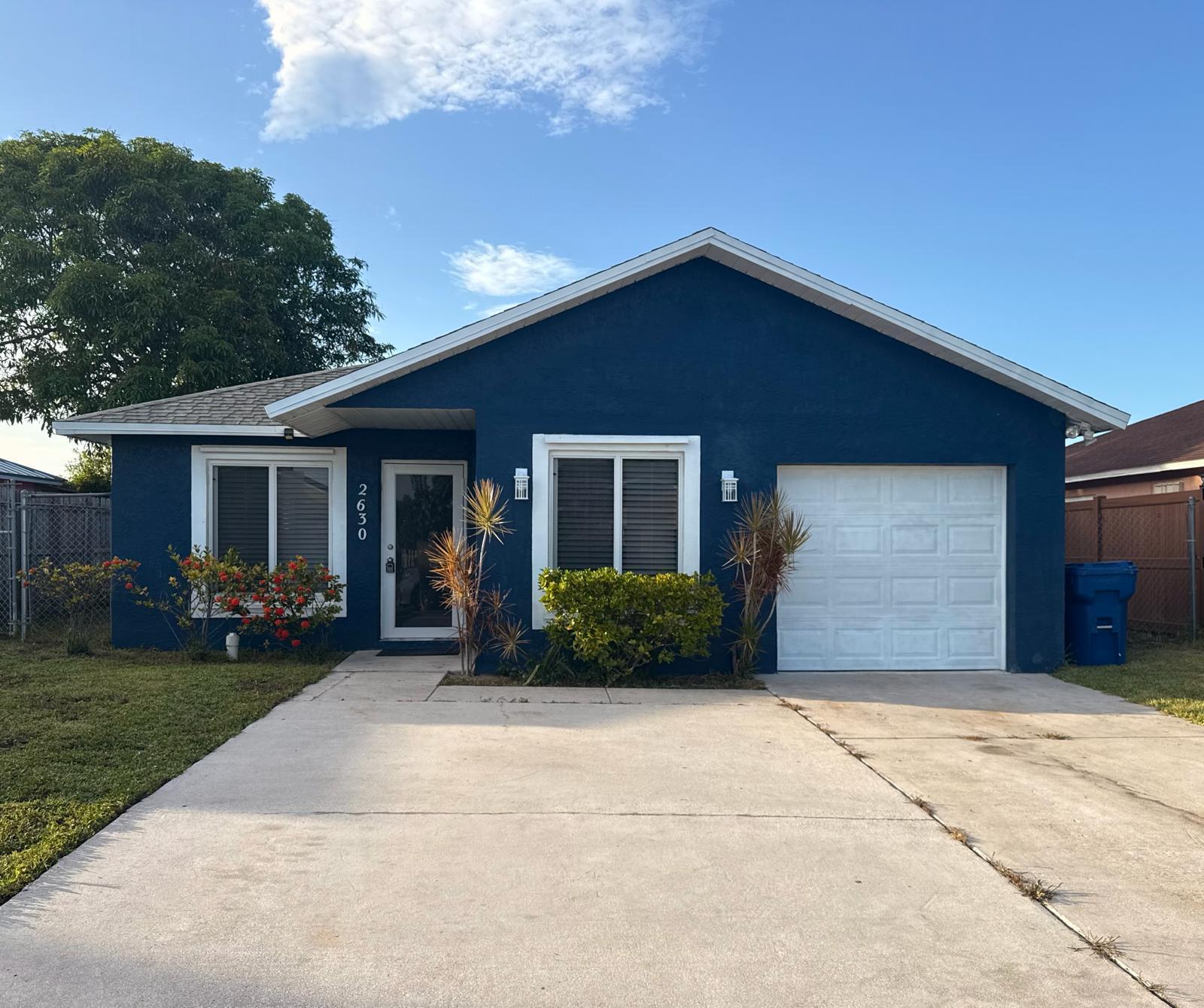 Welcome to this beautifully updated 3-bedroom, 2-bath CBS home with a 1-car garage in Riviera Beach! This move-in-ready residence features a brand-new kitchen with stainless steel appliances, beautifully renovated bathrooms, new flooring, fresh interior paint, and modern finishes throughout. Offering a spacious and functional layout, this home is designed for comfortable everyday living and effortless entertaining. It has impact doors and windows. Conveniently connected to public water and sewer, this property is ideally located near shopping, dining, schools, parks, major highways, and just minutes from the area's beautiful beaches. With a voluntary HOA and no HOA fee, this is an excellent opportunity for homeowners and investors alike. Schedule your showing today!