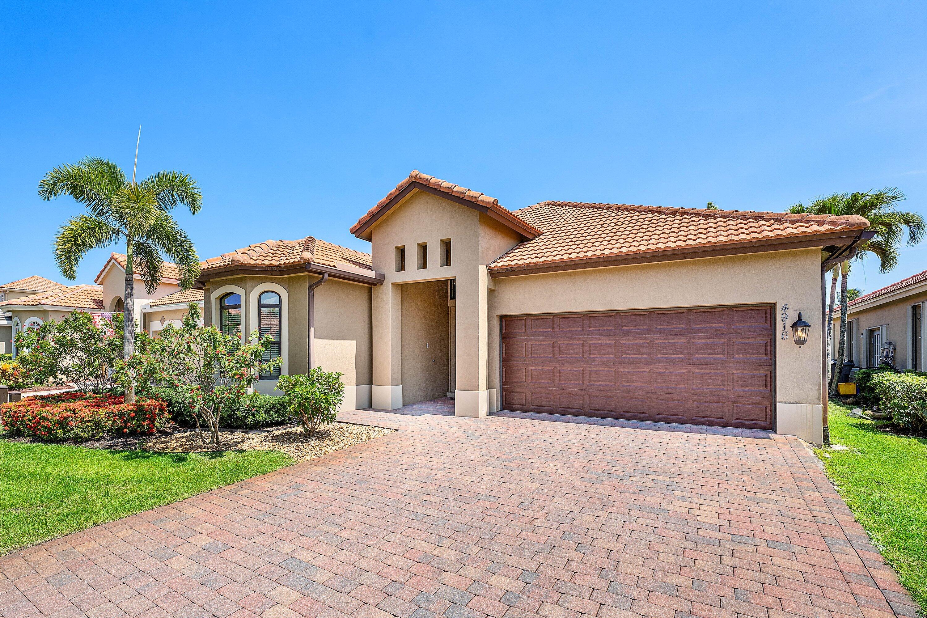 Immaculate, fully furnished lakefront pool home in the gated community of Gateway Gardens. Built in 2016 making it one of the newest homes in the neighborhood. This residence combines a bright, open layout with high ceilings, expansive windows, & peaceful lake & pool views. The spacious kitchen features custom cabinetry, granite countertops, stainless steel appliances, a large breakfast bar, & seamless connection to the main living & dining areas. Designed for easy South Florida living, multiple French doors open to a covered lanai overlooking an oversized pool, huge patio, tropical landscaping, and the lake beyond. The outdoor space also includes a cabana bath, outdoor shower, & bar area, ideal for entertaining or relaxing poolside. Hurricane impact windows provide added security and peace of mind. Exceptionally clean and meticulously maintained, this turnkey home is ready to enjoy from day one.