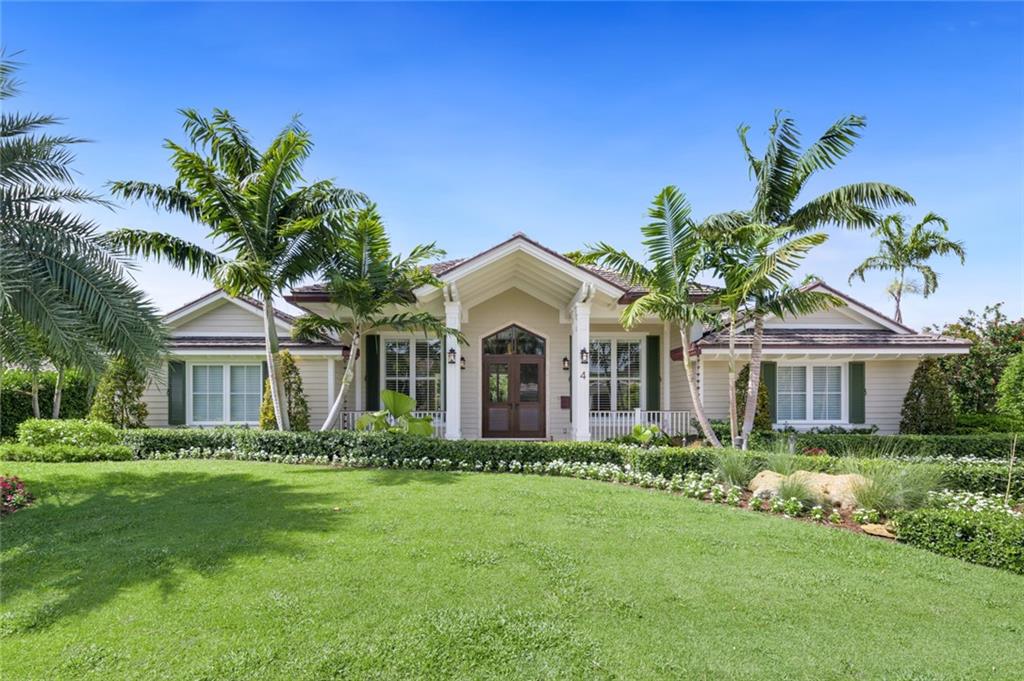 Sensationally rebuilt and reimagined luxurious custom home nestled in exclusive Sea Ranch Lakes community.  This 4BR/4BA residence was recrafted with exceptional materials and premium finishes. The meticulously upgraded interior dazzles with an open floorplan, 12’+ ceilings, European oak hardwood floors, gorgeous tongue-and-groove vaulted ceilings, and an open concept kitchen featuring GE Monogram applications, quartzite countertops, and a waterfall island.  Unparalleled entertaining is found in the enclosed backyard, which has a new heated pool and spa area, a covered lanai, and a full outdoor kitchen with a built-in Wolf grill.  Sea Ranch Lakes gated community features a private beach club and pool, its own police force, and nearby excellent schools. Come see it today!