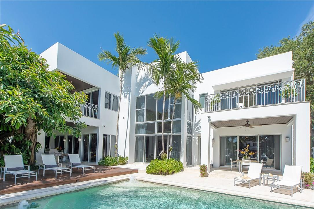 A one third acre tropical oasis with one hundred feet of prime dockage. This is a magnificent, deep water estate designed by noted architect Robert Tuthill! Breathtaking two story living room with dramatic 23' Coquina stone fireplace. Truly a professional chef's AND baker's kitchen with a six burner Wolf gas range, sub-zero refrigerator, three dishwashers, three sinks, multiple ovens, beverage center, custom cabinetry, butler's pantry and wine room. A gorgeous and secure gated entrance leads to the wide front door. The house has an elevator and impact rated glass doors and windows throughout. There are separate his and hers master baths. Each bedroom features an en suite bath, walk in closet and private balcony or terrace. Located just blocks to Las Olas near a beautiful neighborhood park! Smart house system bywww.controlscape.net