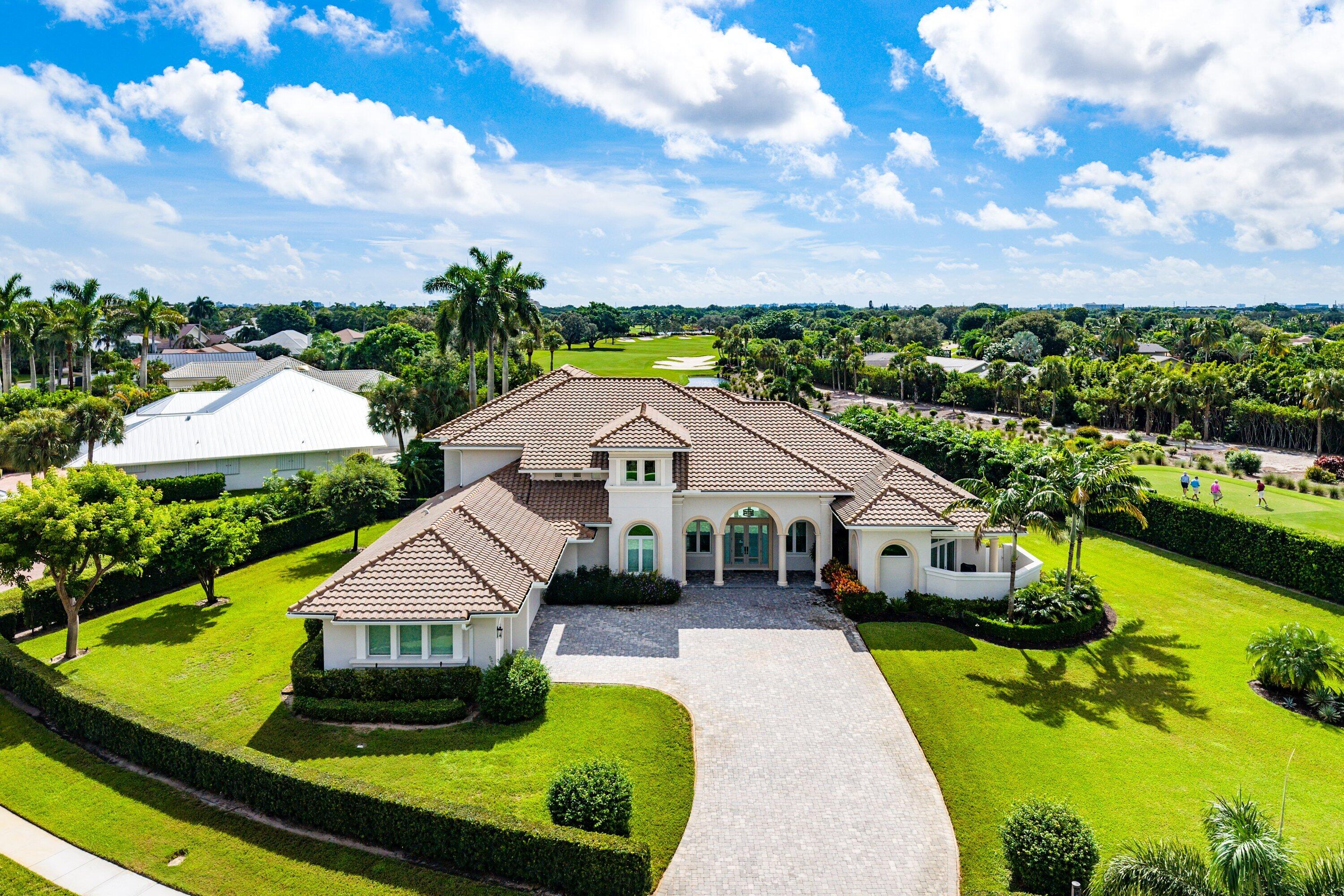 NEWLY BUILT IN 2017, this exceptional custom estate home sits on nearly one full acre with breathtaking water and golf course views in the boutique Bocaire Country Club. Designed for both elegance and comfort, the residence features 6 bedrooms, 6 full bathrooms, a media room, a charming reading nook, and an ideal open-concept layout. Fine wood flooring flows throughout the living areas and all bedrooms. The gourmet kitchen is a chef's dream, showcasing custom shaker cabinetry, quartz countertops, a timeless subway tile backsplash, and a full-size walk-in pantry, ultra-high-end JennAir appliances include a professional gas cooktop with  hood, built-in refrigerator, wine wall and convection double ovens. The thoughtfully designed family room opens seamlessly to family room. The primary suite, with two additional full ensuite bedrooms and a bonus bedroom/office, are conveniently located on the ground floor. The second level offers two full ensuite bedrooms, a spacious media room, private study, built-in wet bar, and a large tiled balcony with expansive views overlooking the lake and golf course.
The home boasts ideal East rear exposure, providing stunning sunrises over the water and fairways. Outdoors, enjoy a generous backyard beyond the expansive pool and patio deck, perfect for entertaining, playing or relaxing. The lushly landscaped grounds are enhanced by a full privacy hedge, offering exceptional seclusion on this nearly one-acre estate lot. Exclusive Bocaire Country Club, limited to just 239 homes, offers exceptional resort-style amenities including championship golf, racquet sports, 24-hour fitness, fine and casual dining, and a warm, close-knit community. Membership extends to parents, children, and grandchildren, making Bocaire truly unique. Ideally located in an A-rated school district and just minutes from beaches, dining, shopping, and major airports, this community delivers an unparalleled South Florida lifestyle.