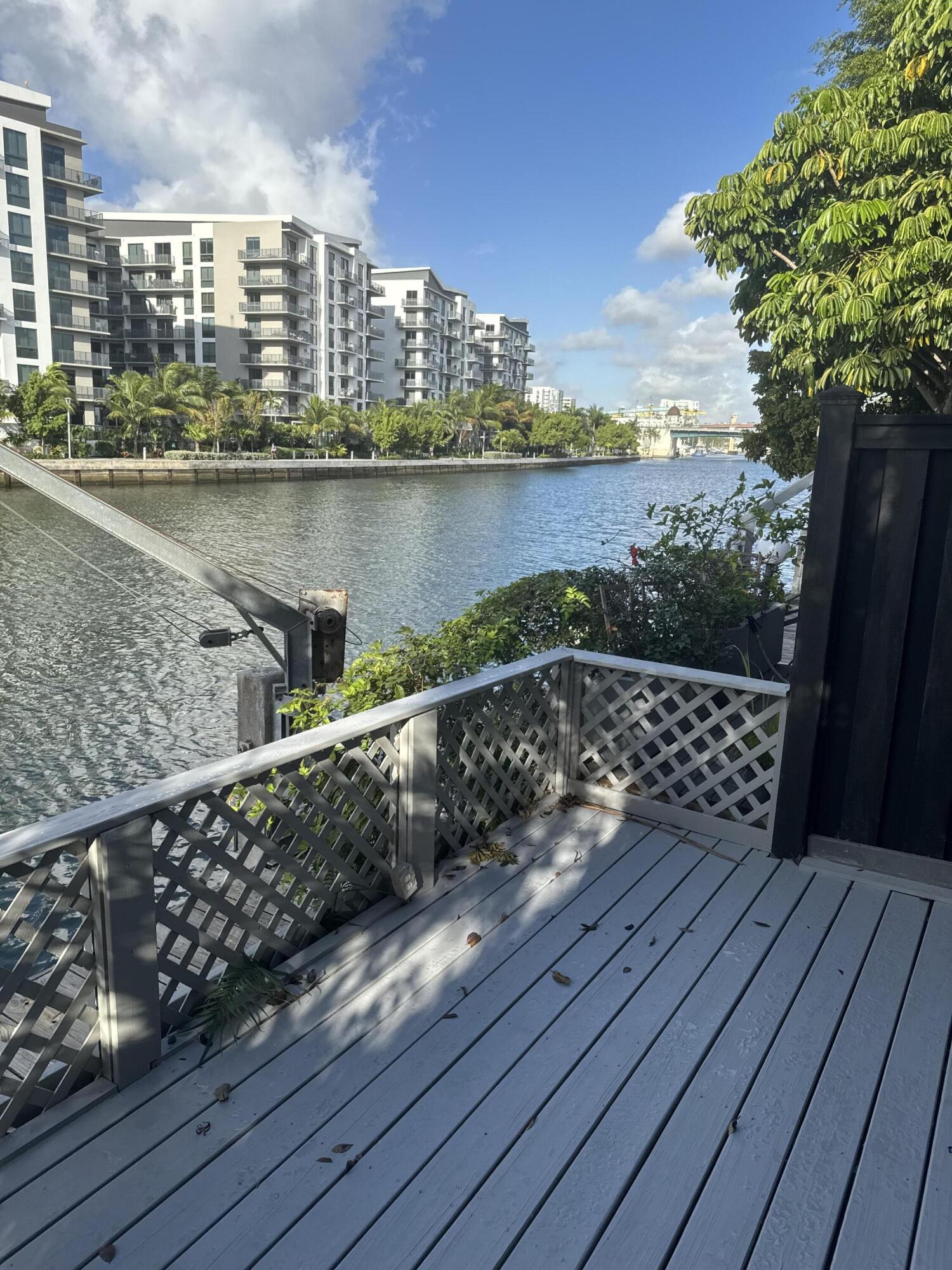 Corner end unit in Tranquil, Lush, Tropical Garden setting on Miami River with private boat dock. No Fixed Bridges to Ocean! Historic Spring Gardens neighborhood in gated complex with pool. Pet Friendly; Two covered parking spaces; Kitchen with Granite Counter Tops and Stainless Steel Appliances; Newly Remodeled Master Bathroom; Central Air; Freshly painted interior; Townhouse is very central to Downtown, I-95 and 836 - 10 minutes to MIA Airport, Miami Design District, South Beach and Coconut Grove. Walk to Civic Center, Winn Dixie, University of Miami Medical Complex and Marlins Stadium.