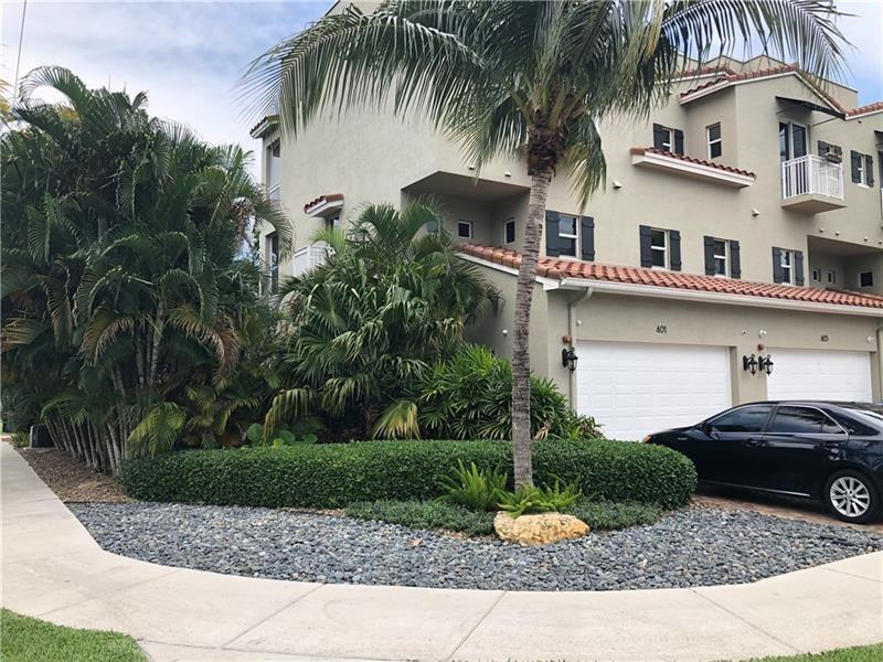 STUNNING UPDATED 3-BEDROOM/3-1/2 BATH 3-STORY CORNER UNIT TOWNHOME WITH A HUGE YARD WITH TIKI-HUT FOR ENERTAINING LOCATED JUST MINUTES TO THE BEACH, DOWNTOWN FORT LAUDERDALE AND I-95! THIS HOME OFFERS TILE FLOORING ON THE 1ST AND 2ND FLOOR. BLACK SOLID WOOD FLOORING ON THE STEPS AND 3RD FLOOR! PRE-WIRED FOR SURROUND SOUND IN THE LIVING ROOM, MASTER BEDROOM AND 3rd FLOOR GUESTROOM. GARAGE FLOOR IS TILED FOR THE ULTIMATE MANCAVE