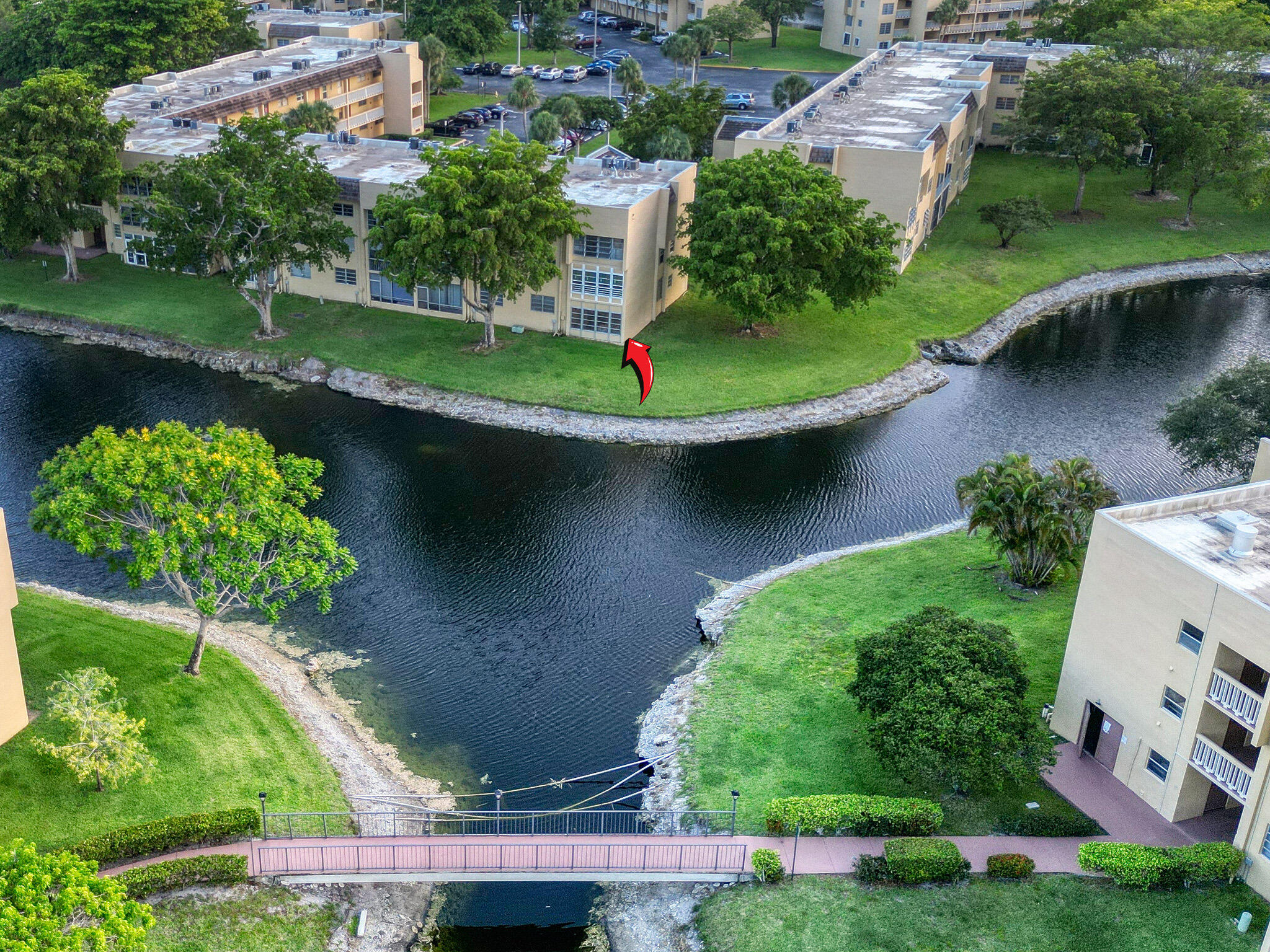 Welcome to this beautifully updated 2-bedroom, 2-bath corner condo located in the desirable 55+ community of Bermuda Club. This first-floor end unit offers exceptional privacy and an abundance of natural light thanks to additional windows, along with peaceful views of the pool and surrounding lakes.  Inside, the home features wood flooring throughout, a newly remodeled primary bathroom, and a modernized kitchen with brand-new appliances and a cozy breakfast nook, perfect for enjoying your morning coffee. Convenience is key with your assigned parking space located just steps from the front door.  Residents of Bermuda Club enjoy a wide range of amenities including:  Community pools Clubhouse Fitness center Shuffleboard courts Beautifully maintained grounds and lakes